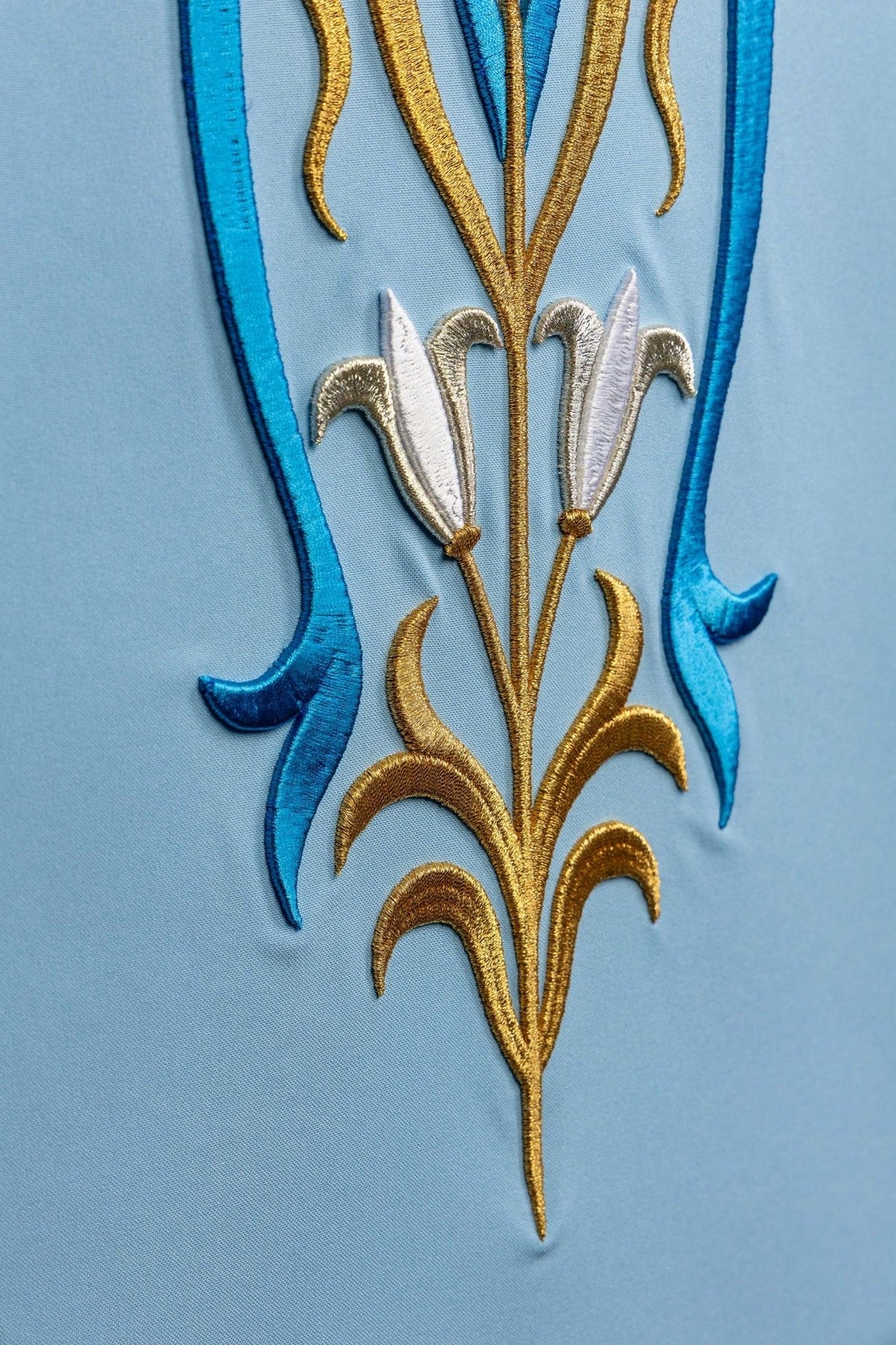 Church lectern cover close-up of gold and blue Marian embroidery