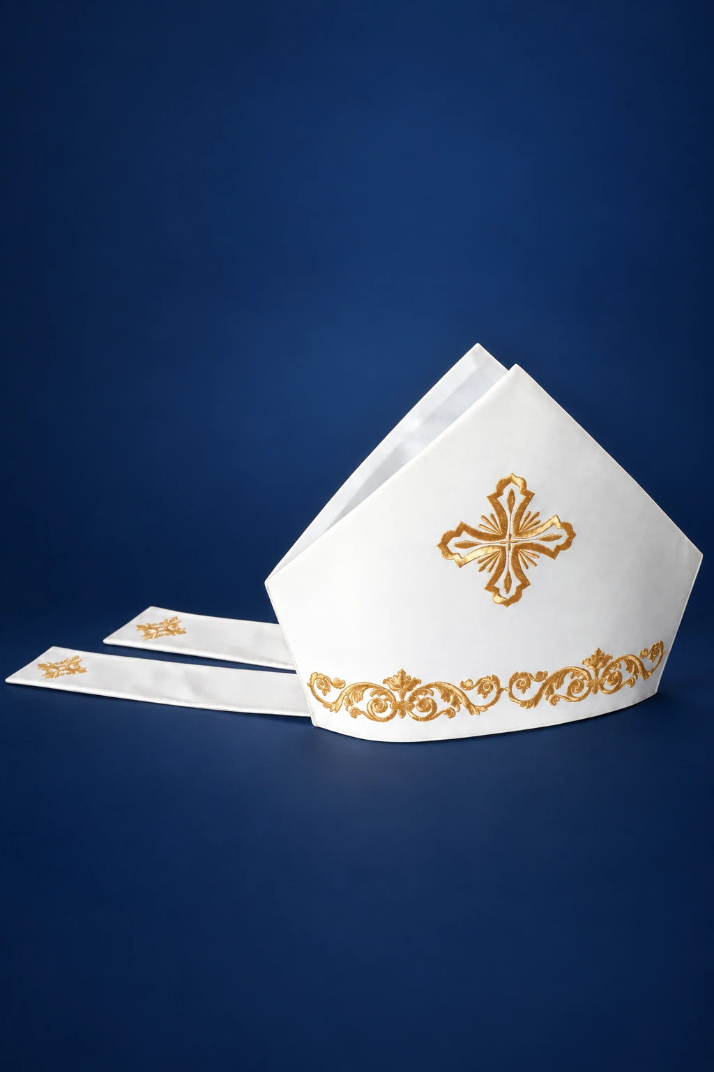 Miter with Gold Cross Embroidery, front view in white with gold cross and ornate gold embroidery