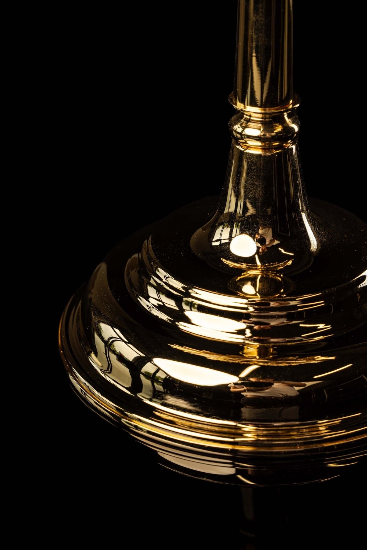 Monstrance detail of the reflective tiered base and stem