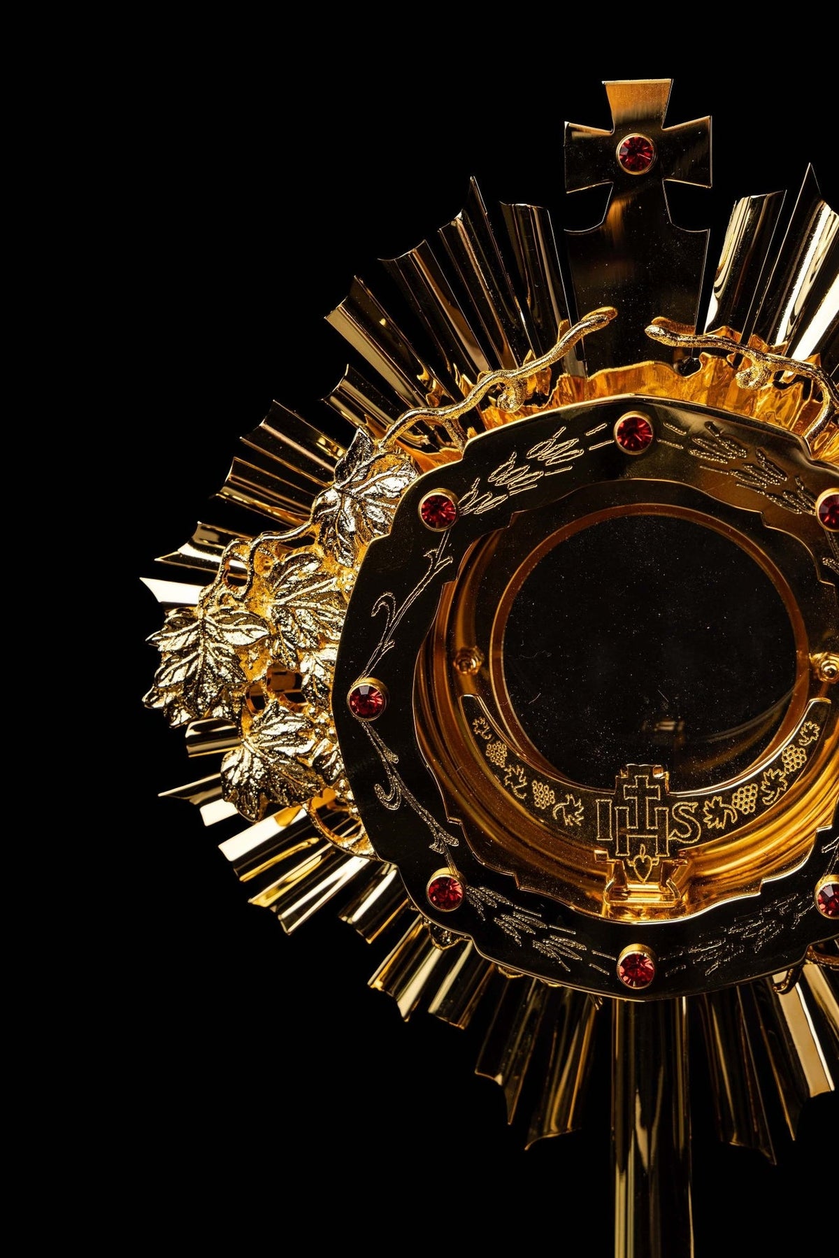 Catholic monstrance close-up of grapevine relief and engraved black enamel ring