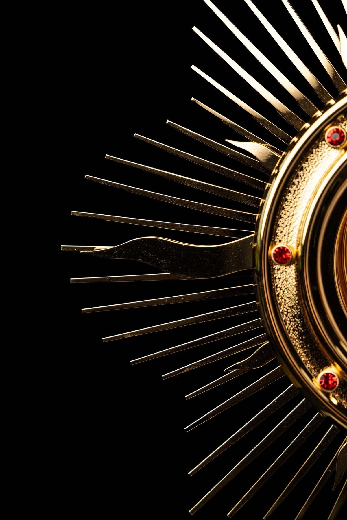 Gold-plated radiant monstrance luna with ornate IHS and grape motifs