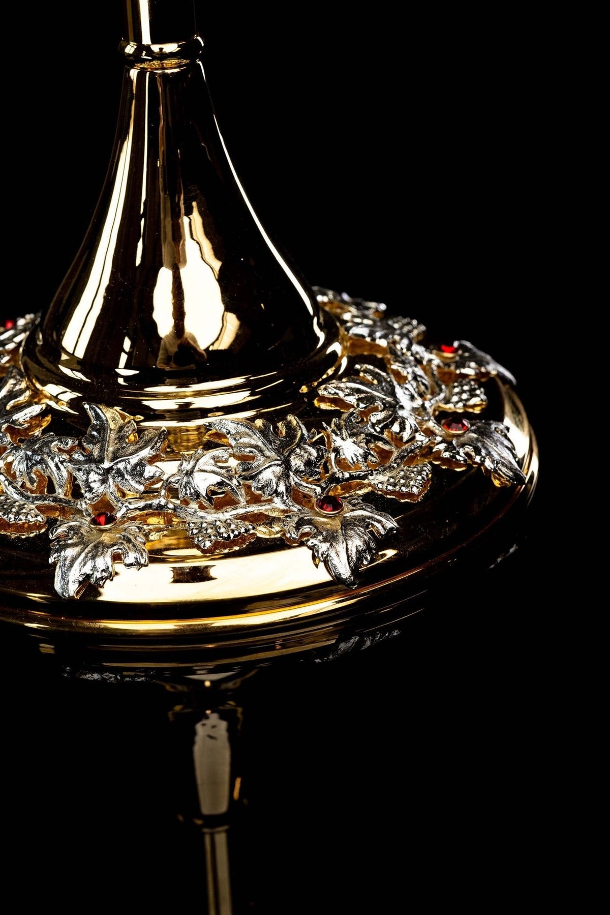 Monstrance detail of gold-plated stem with ornate silver openwork knop