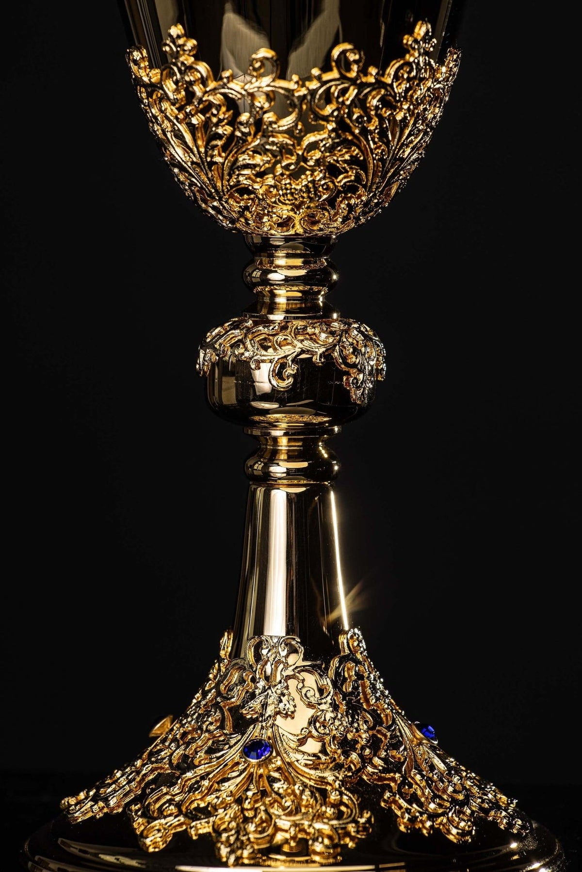 Gold-plated chalice front view showing ornate cup, stem, knop and base