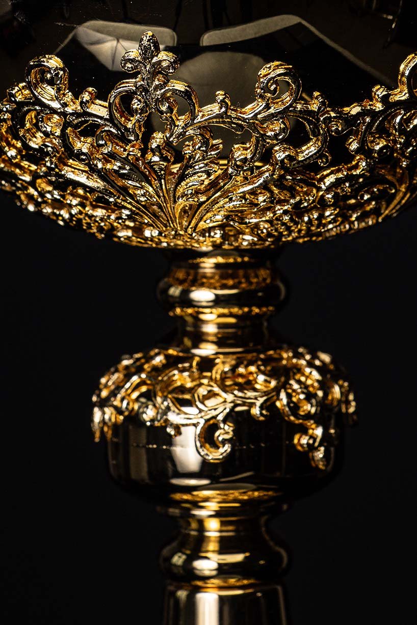 Gold-plated ciborium side close-up of intricate scrollwork along the bowl rim
