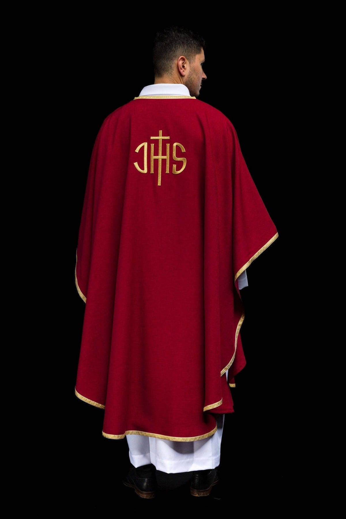 Red chasuble back view with gold IHS embroidery and trim