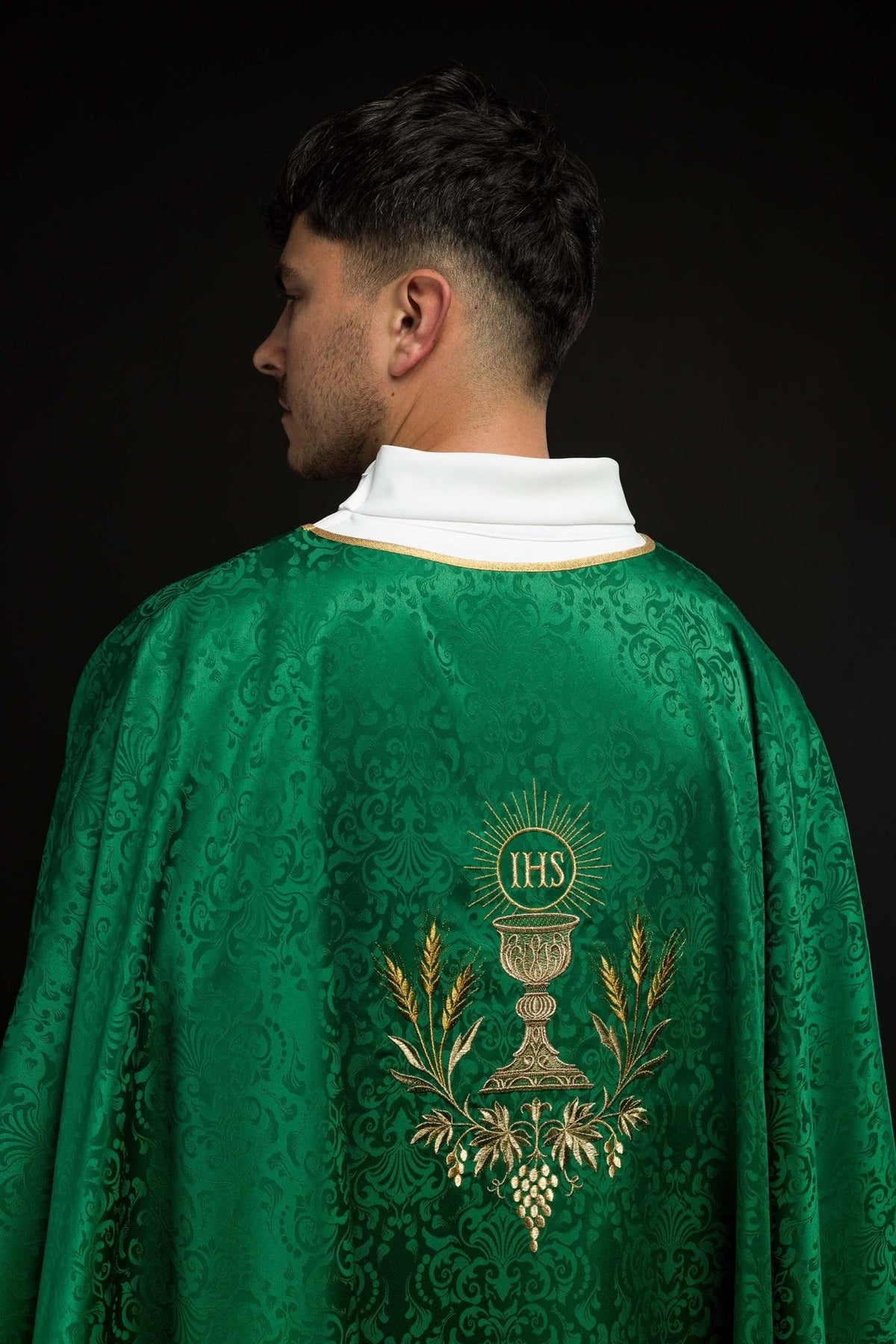 Green chasuble back close-up with chalice and IHS monogram embroidery