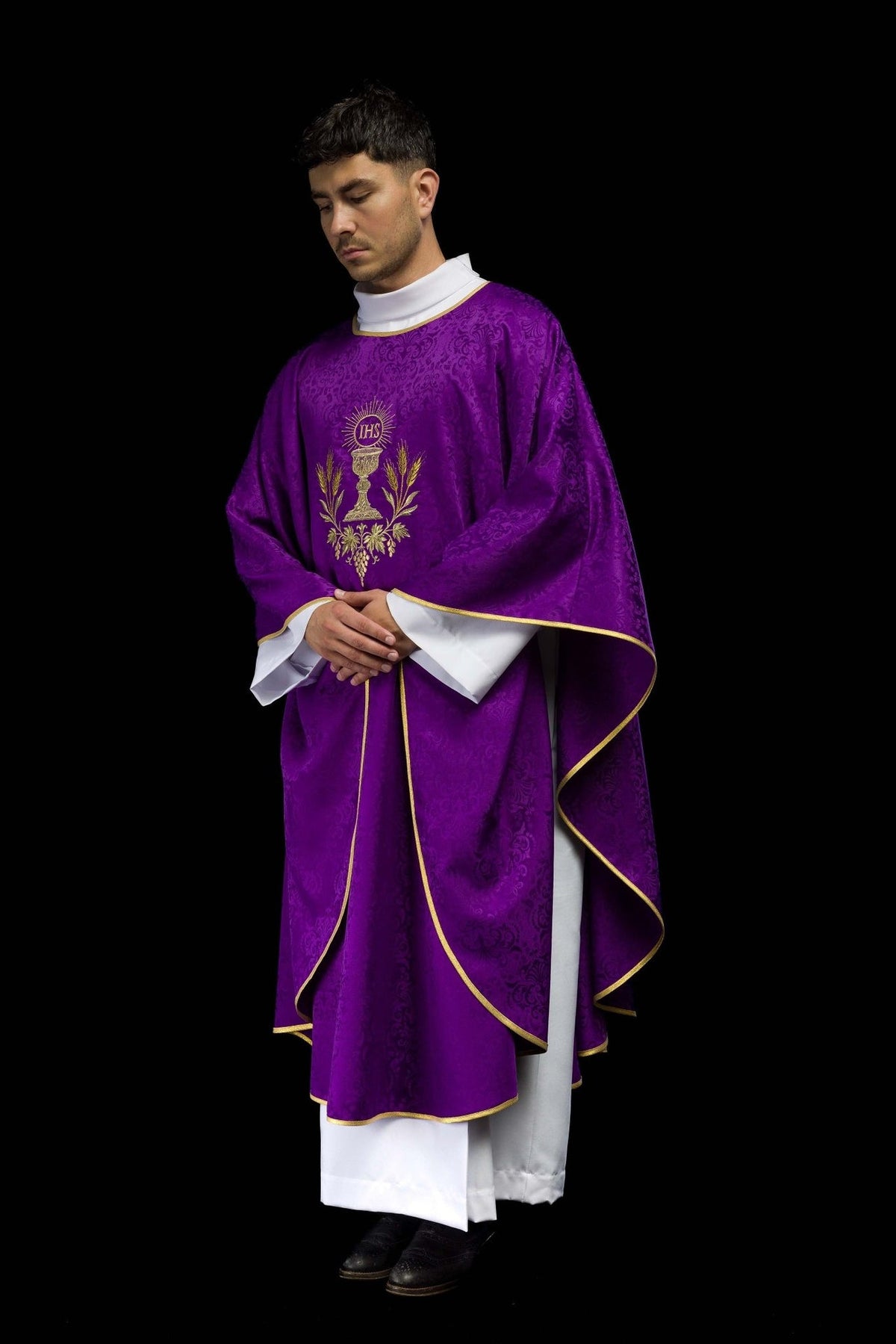Purple chasuble three-quarter front view with gold trim and chalice embroidery