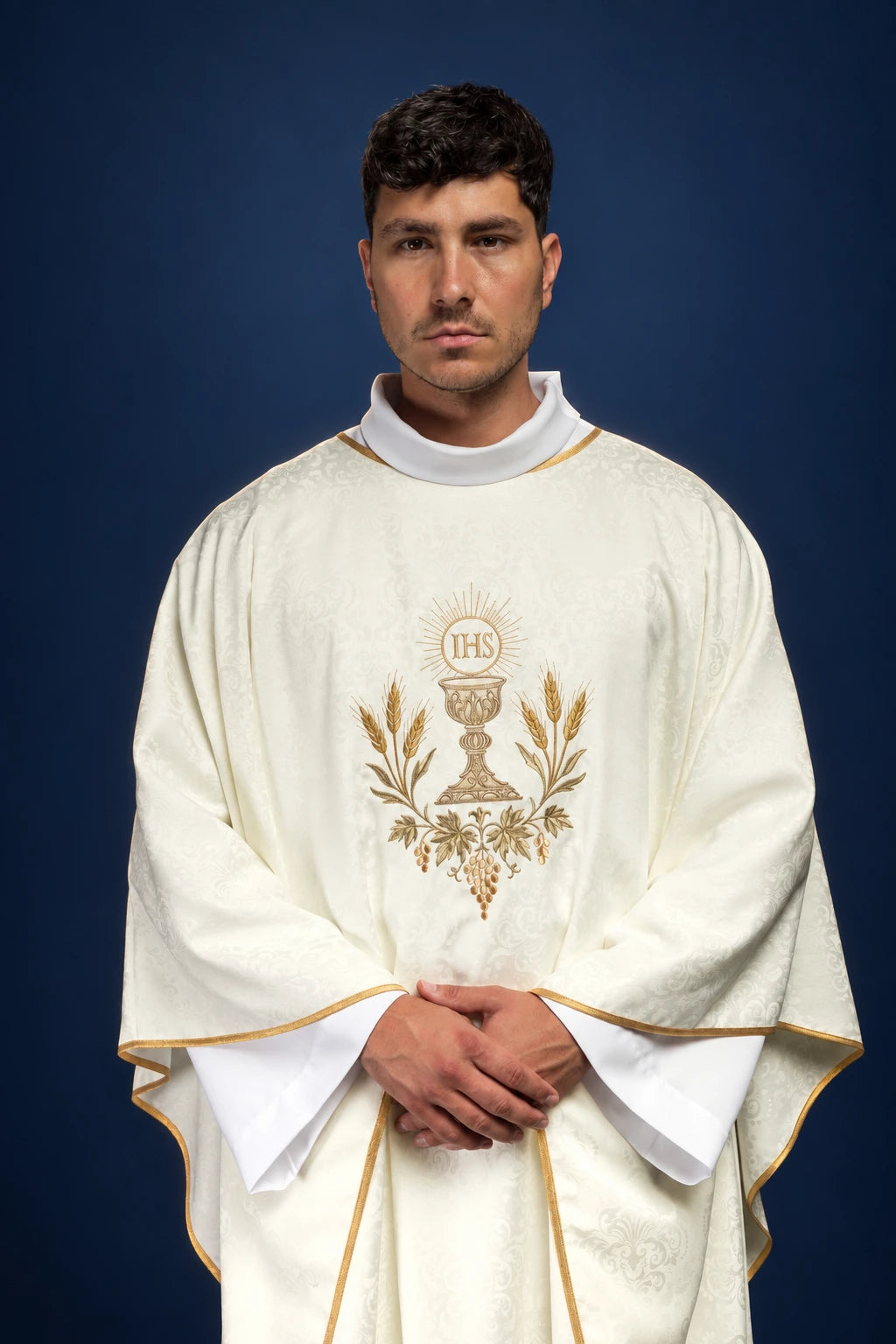 Ecru Liturgical Chasuble with Eucharistic Embroidery worn front view with gold IHS monogram, chalice, wheat and vine