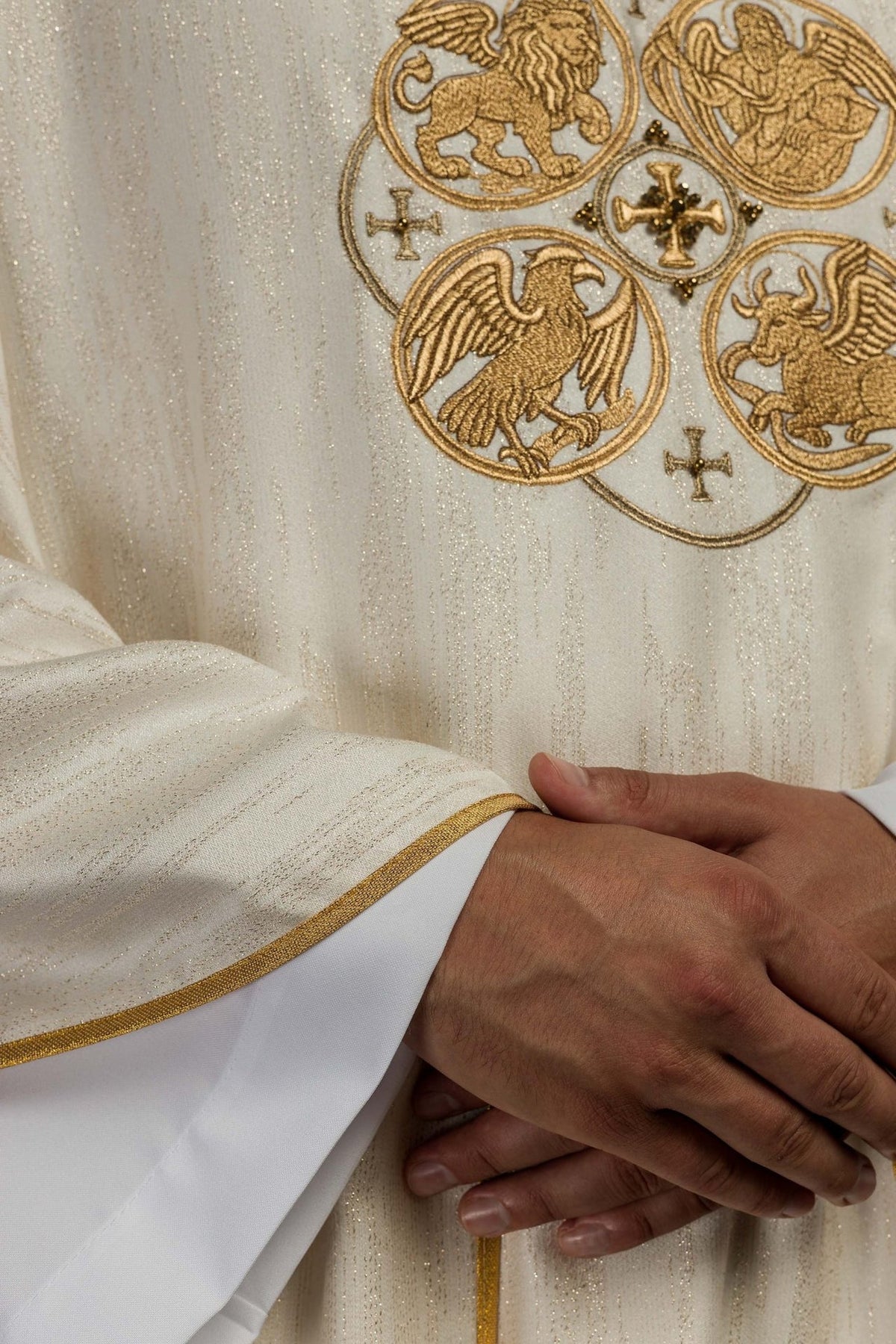 Ecru chasuble close-up of gold trim and embroidered eagle