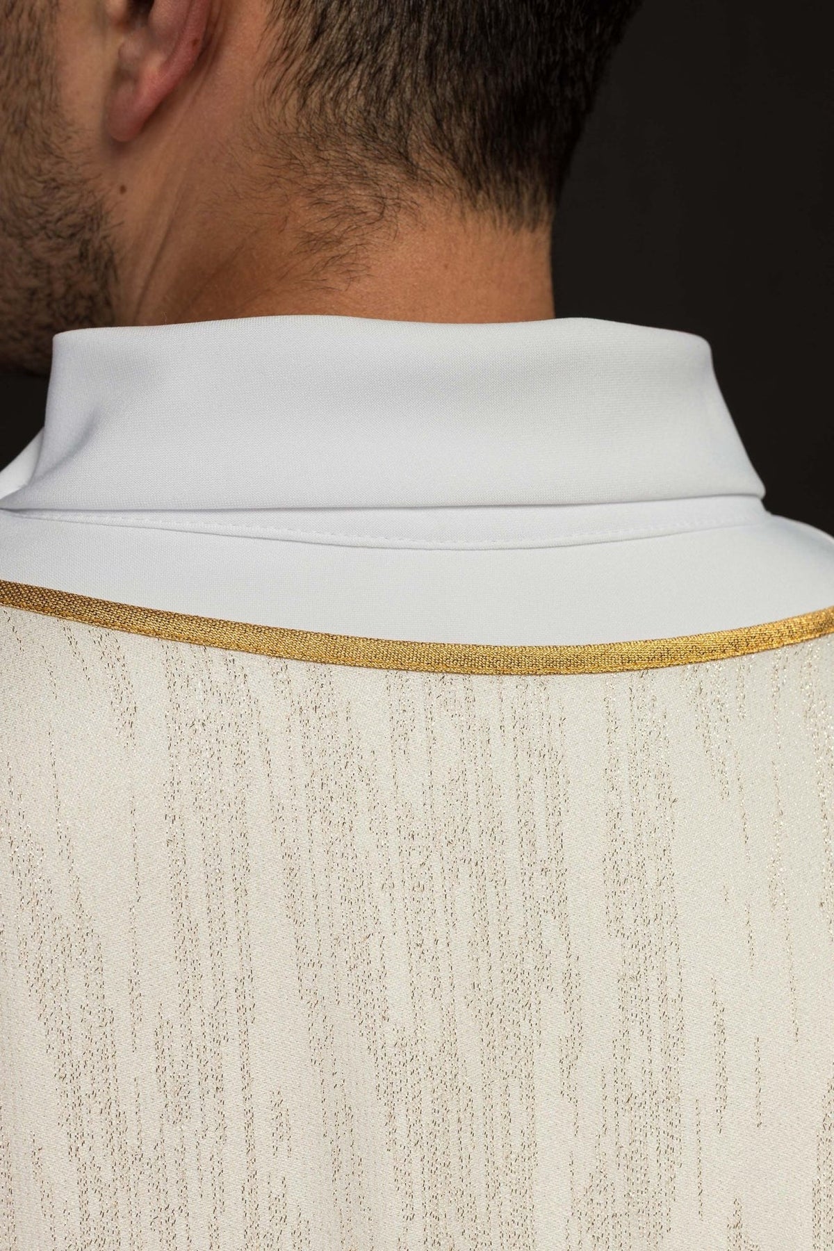Ecru chasuble close-up of white collar and gold trim