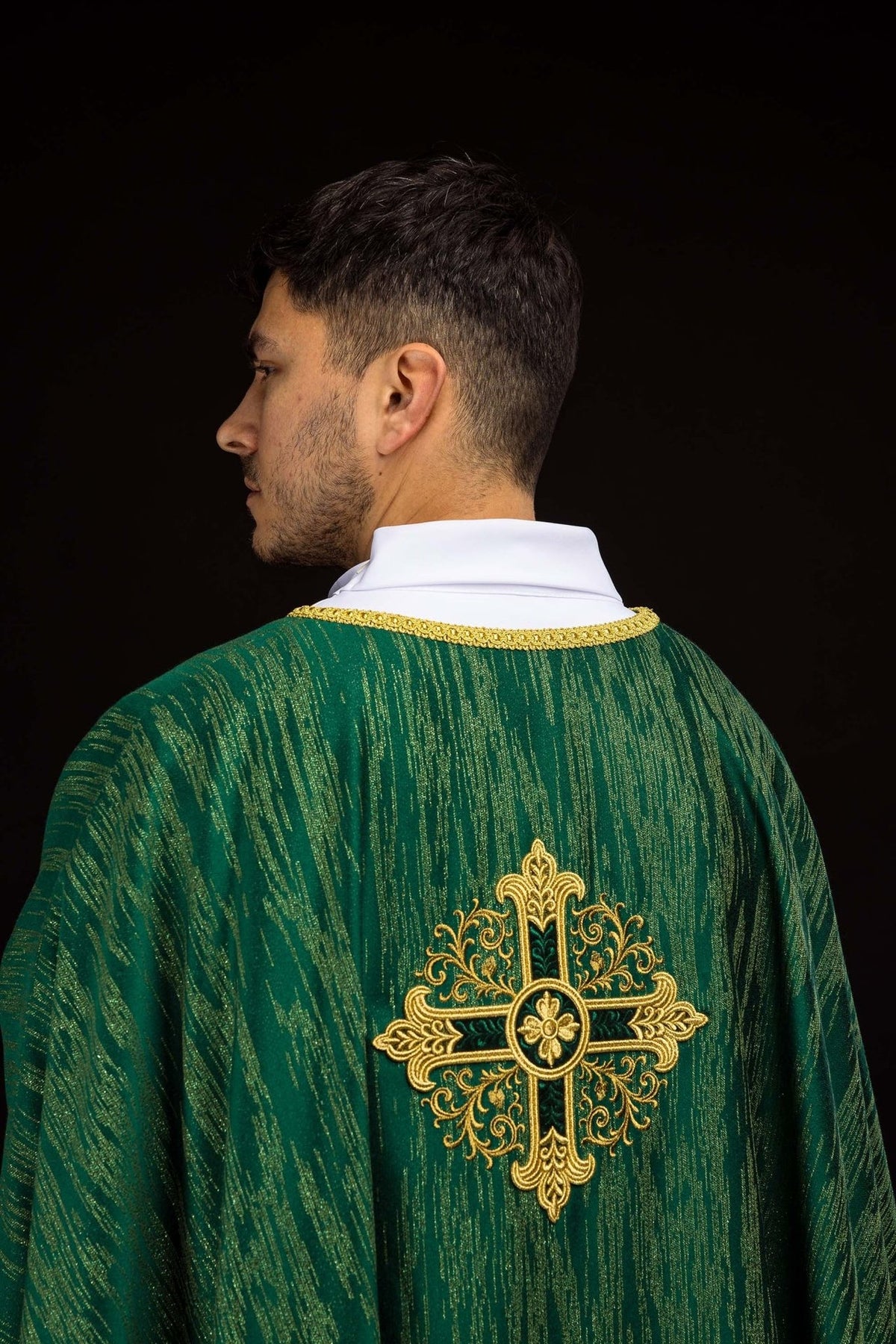 Green chasuble close-up of white collar and gold neckline trim