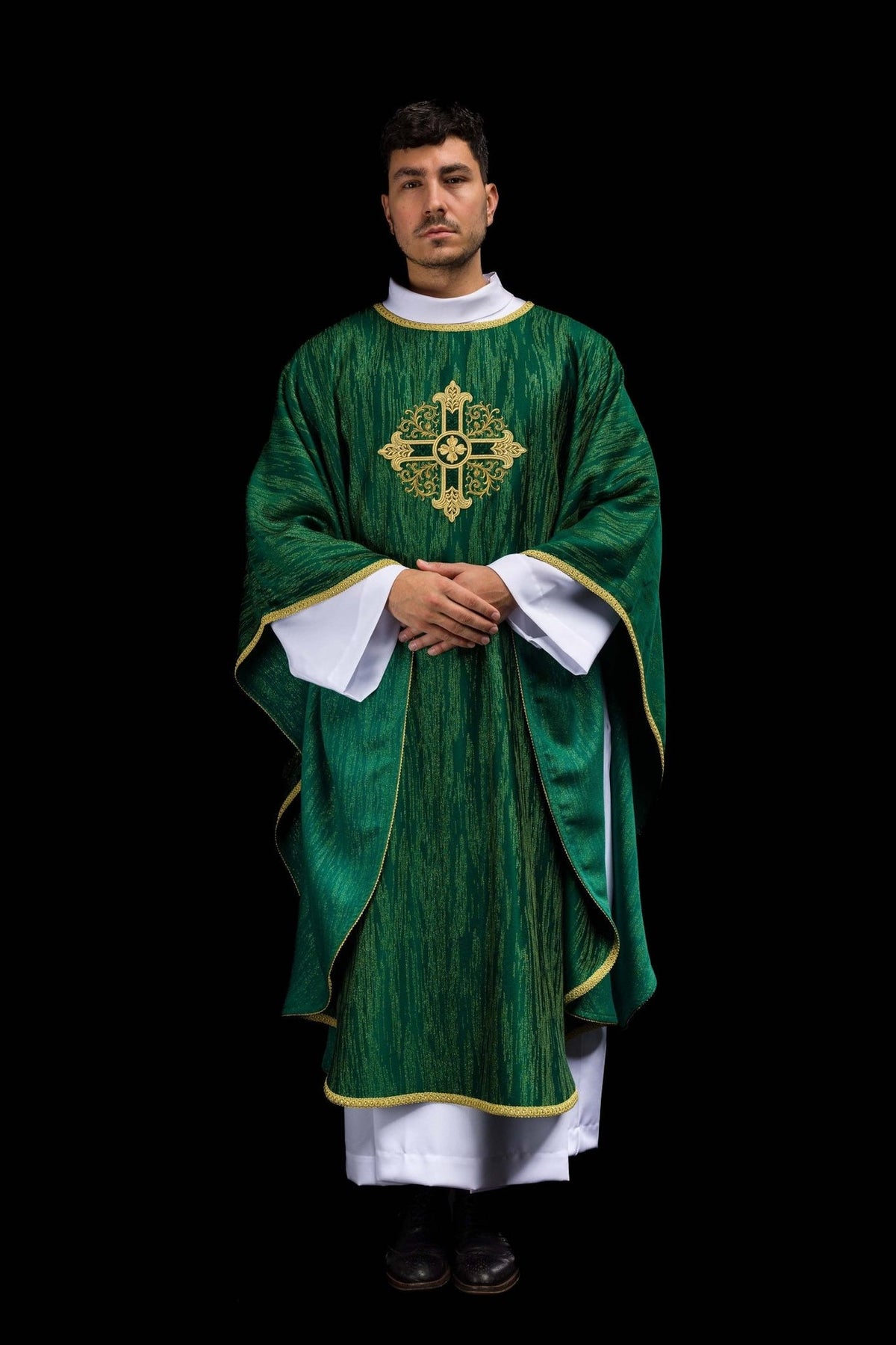 Green chasuble full back worn view with gold cross embroidery