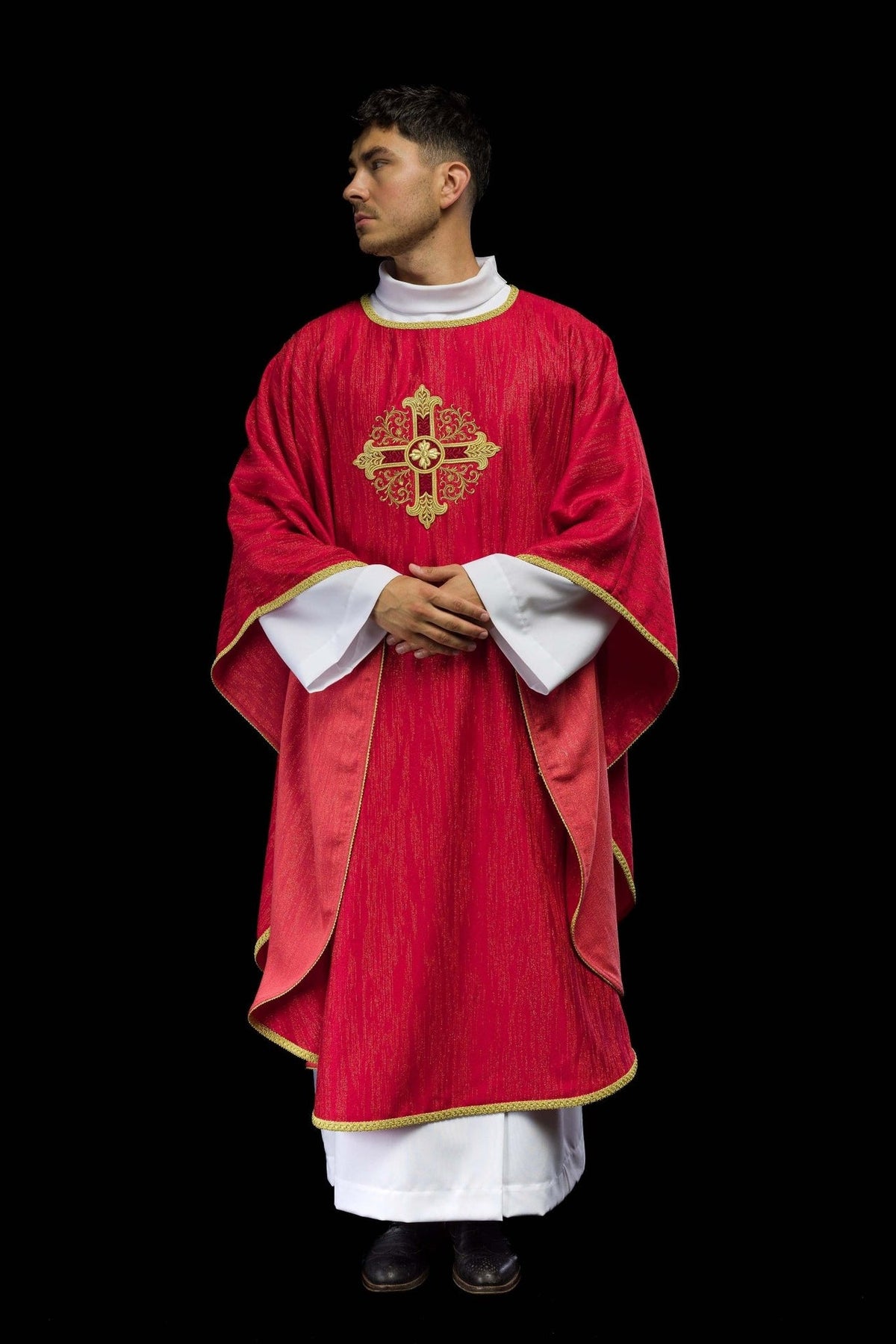 Red chasuble front view showing flowing side panels and gold trim