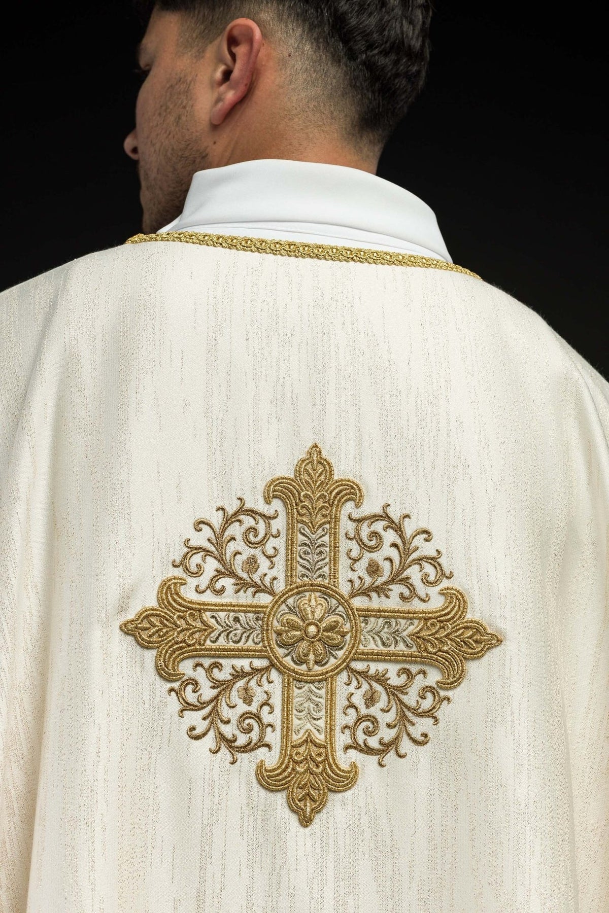 Ecru chasuble back view with large gold embroidered cross