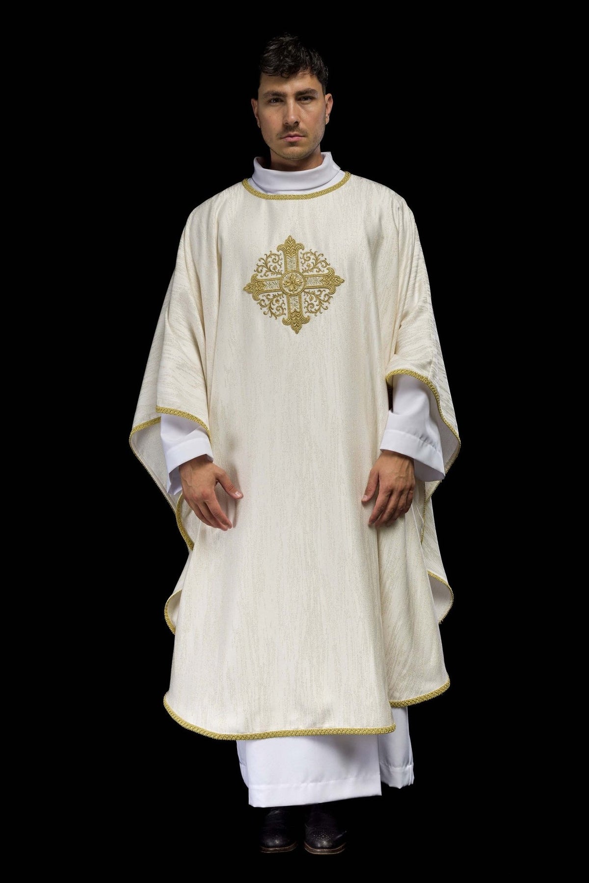 Ecru chasuble front view showing decorative fabric and gold cross