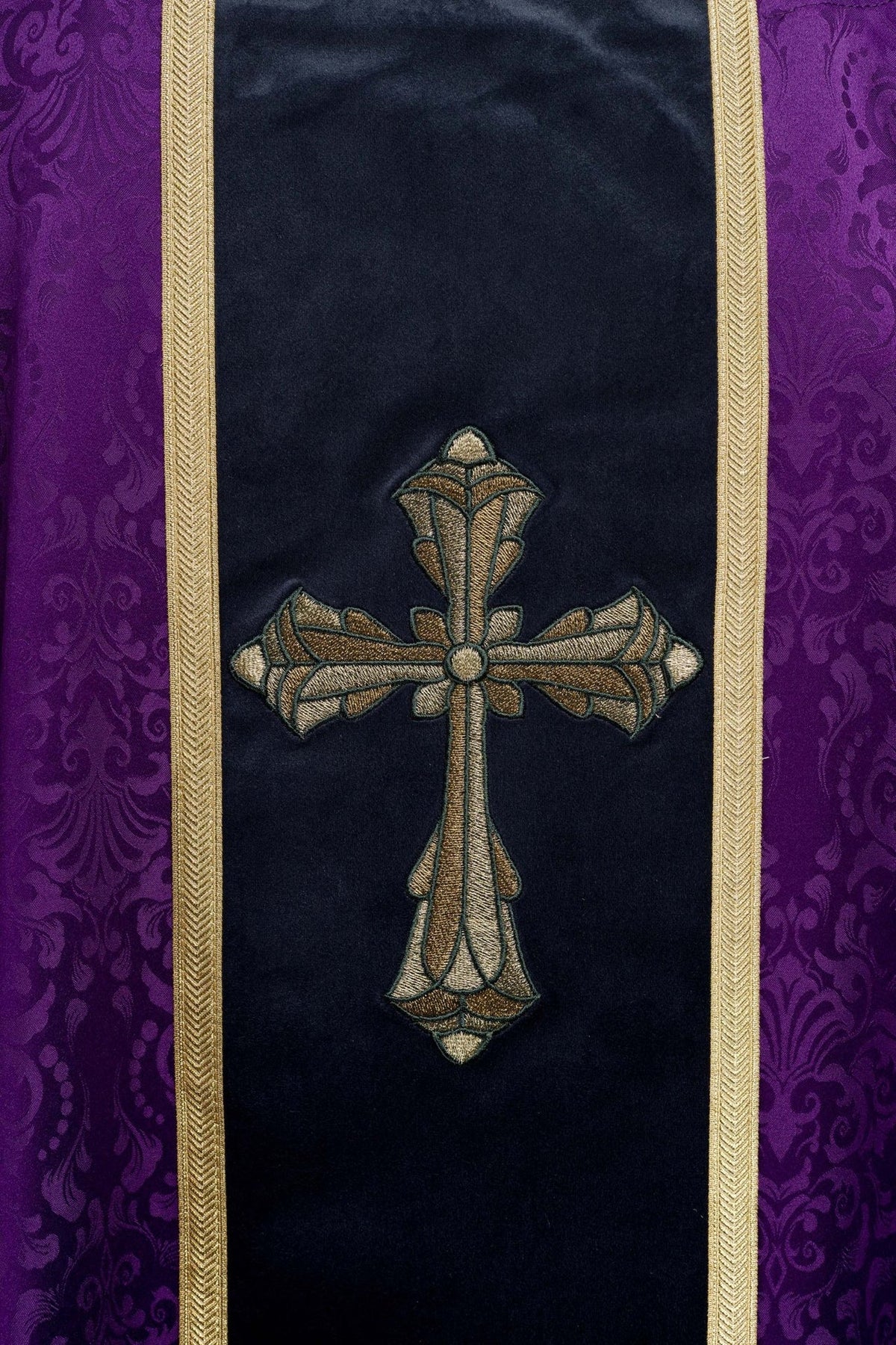 Purple chasuble, detailed front view of the gold cross and trim