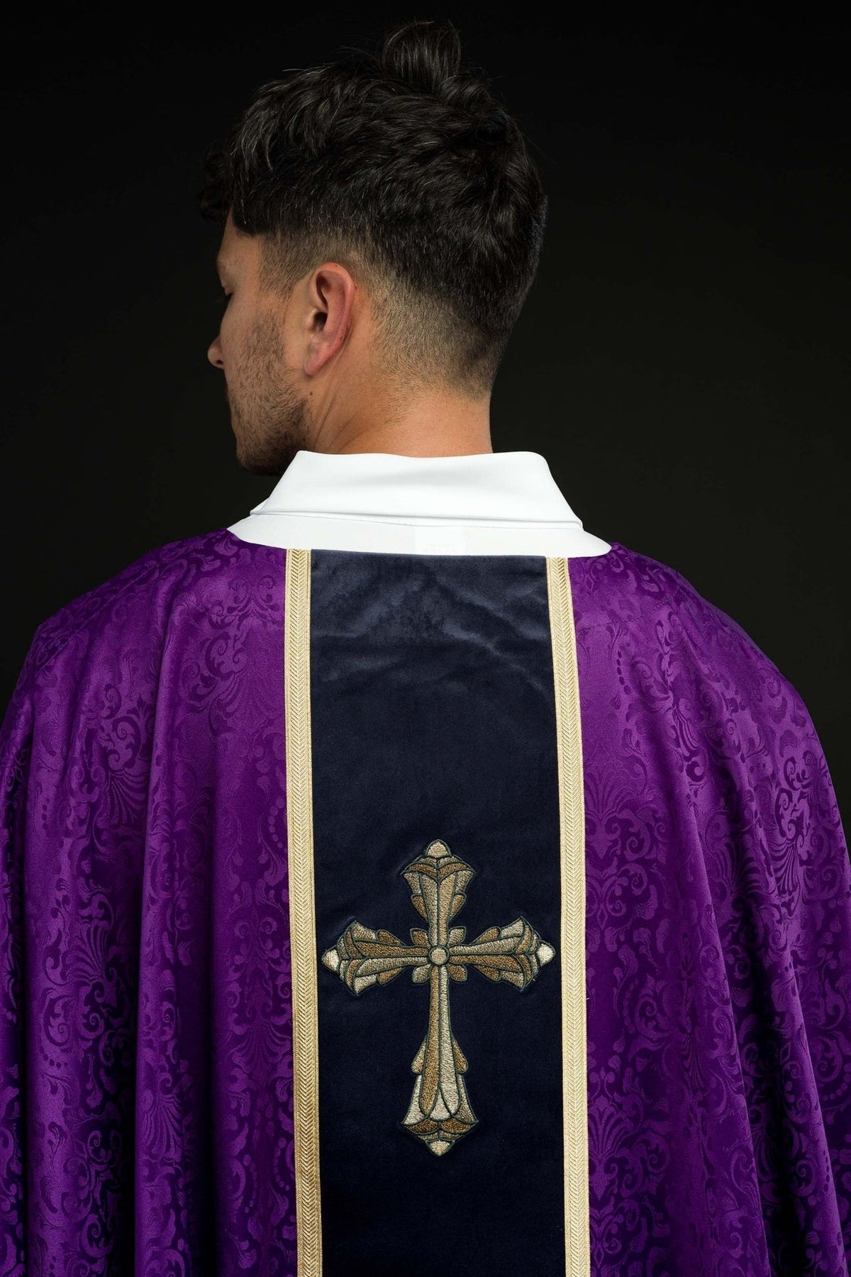 Purple chasuble, side close-up showing jacquard fabric and gold trim