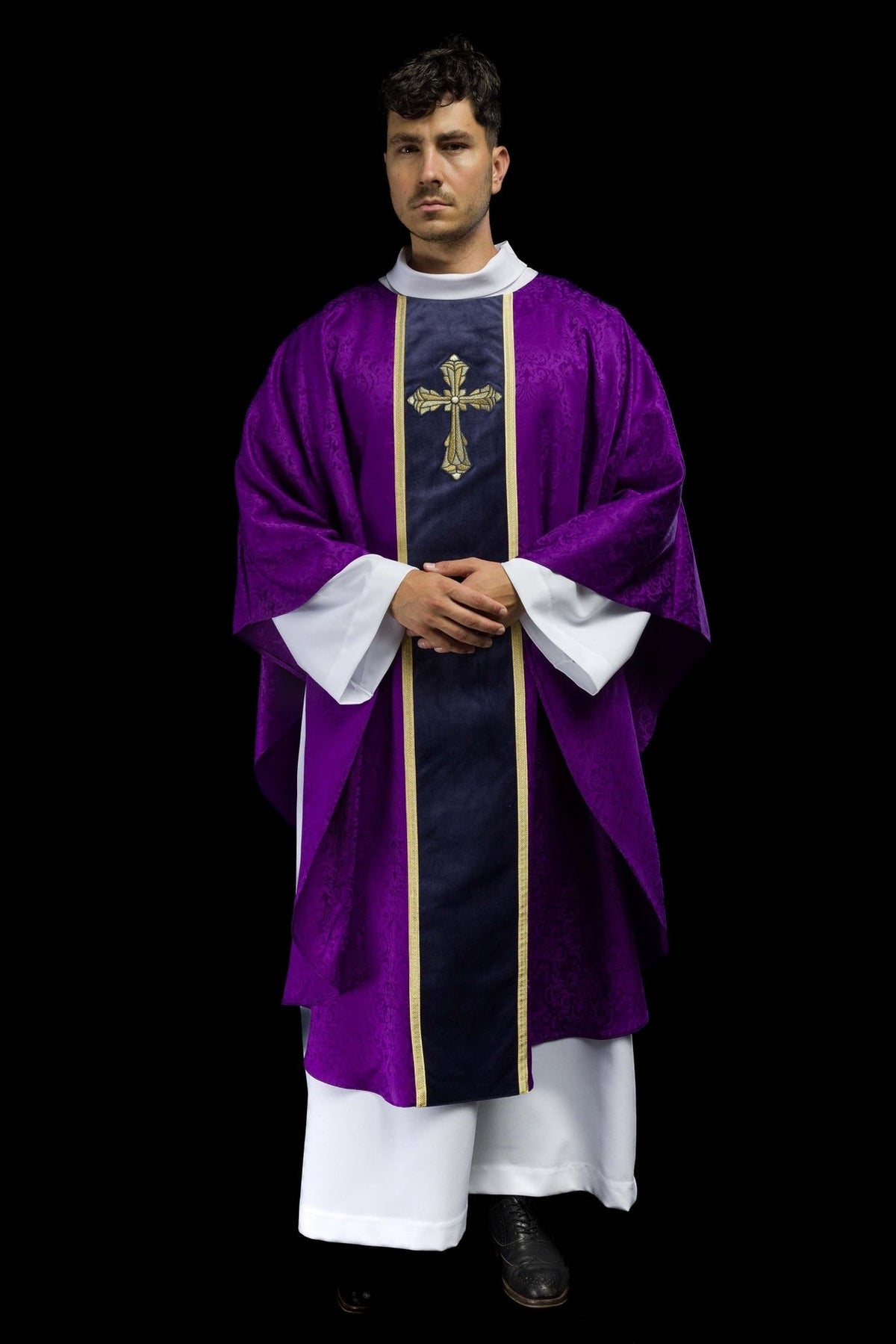 Purple chasuble, angled front view with dark orphrey and gold cross