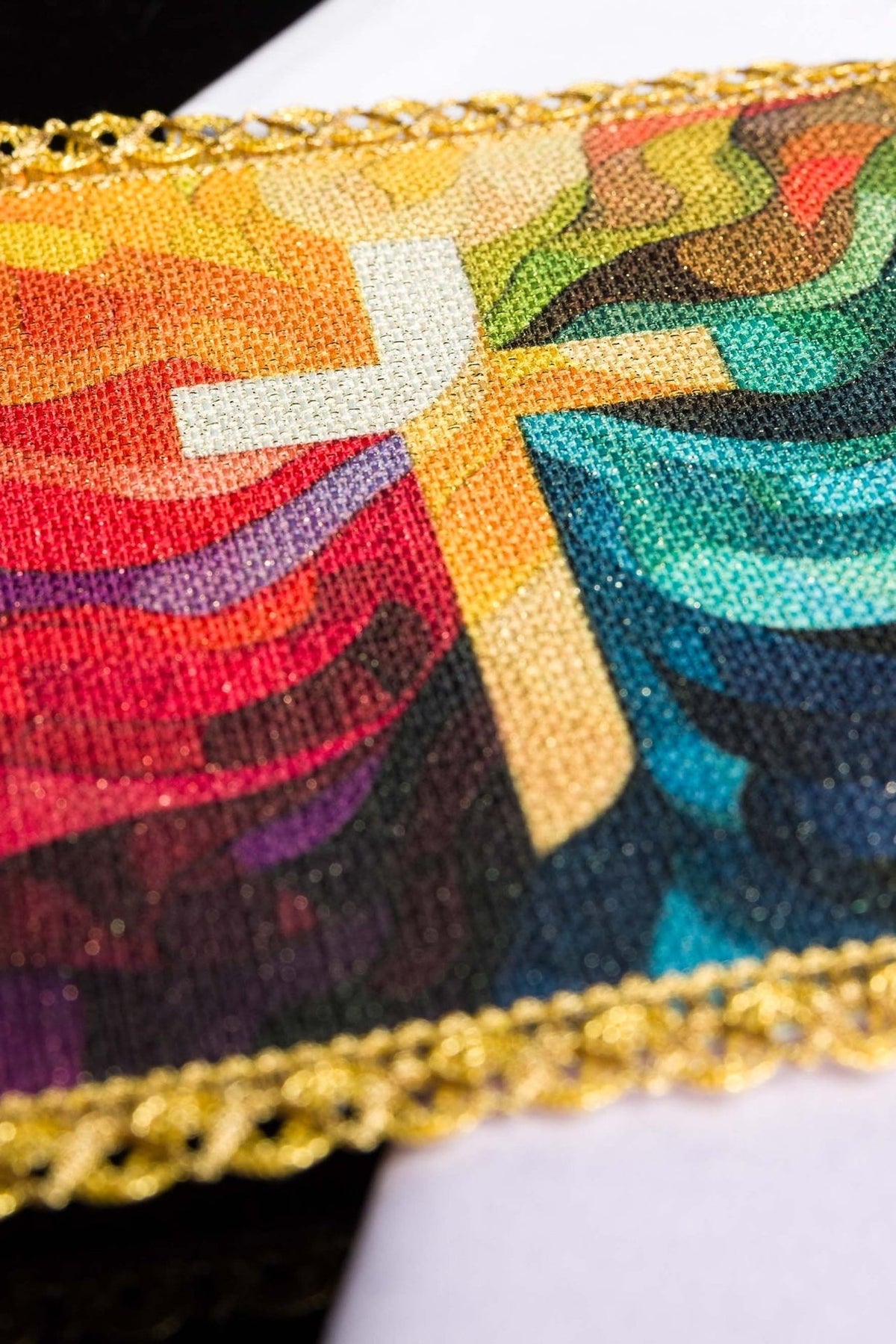 Altar linen set close-up showing colorful printed cross motif and gold trim