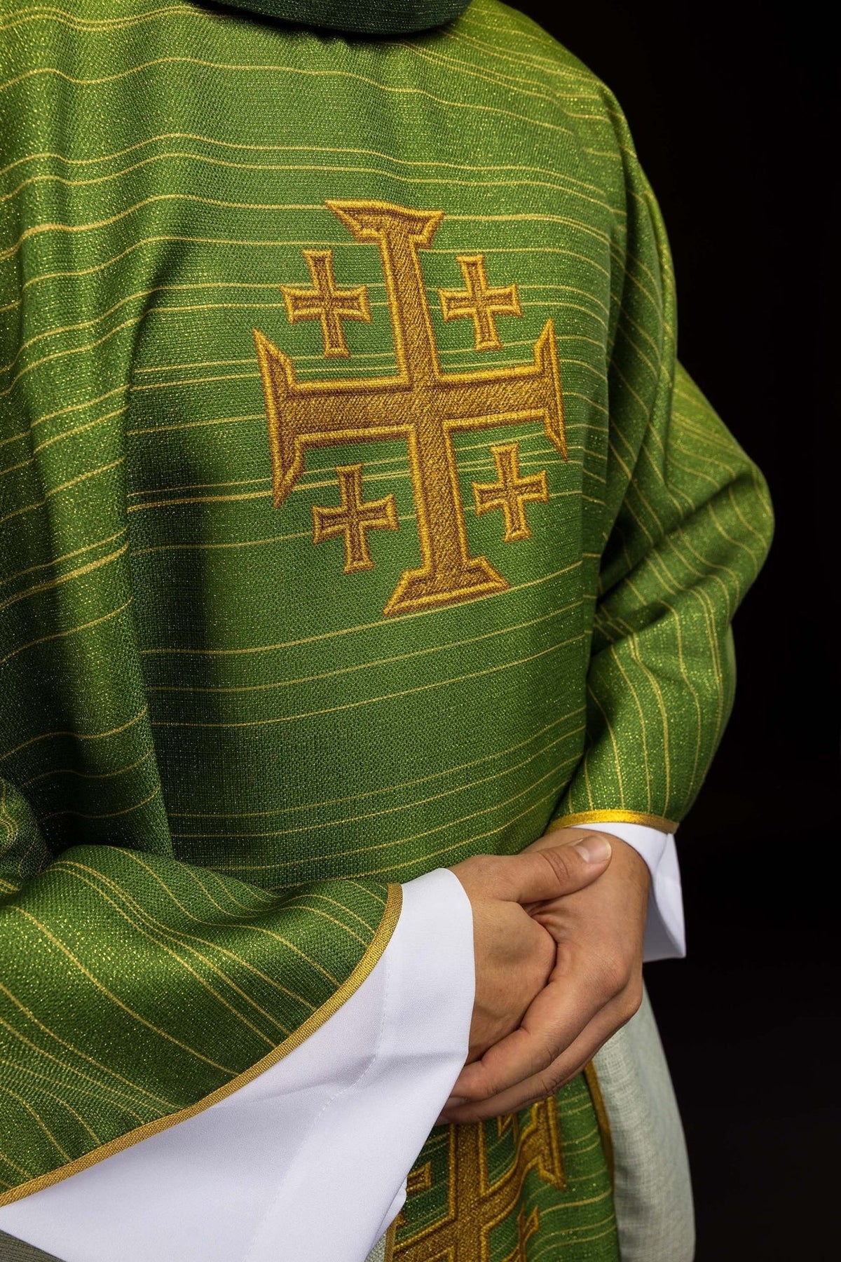 Green chasuble side view with gold Jerusalem cross and edged sleeves