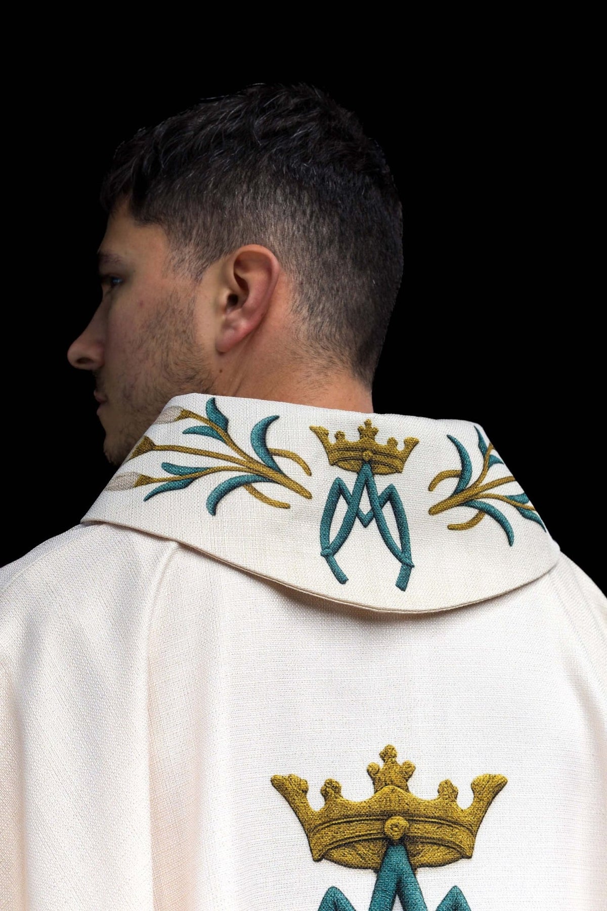 Marian chasuble back view with cream fabric, gold crown and blue monogram
