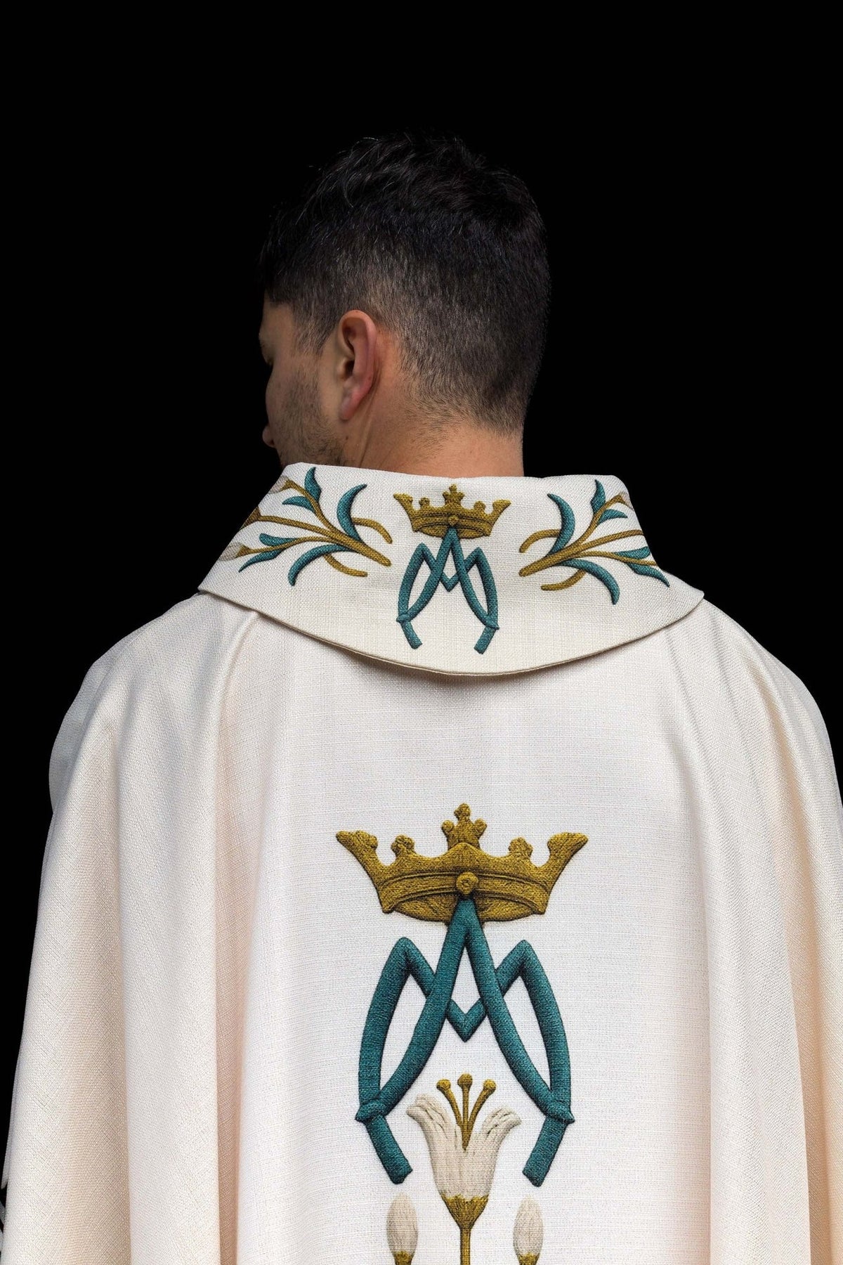 Cream Marian chasuble back view with central lily pattern and gold trim