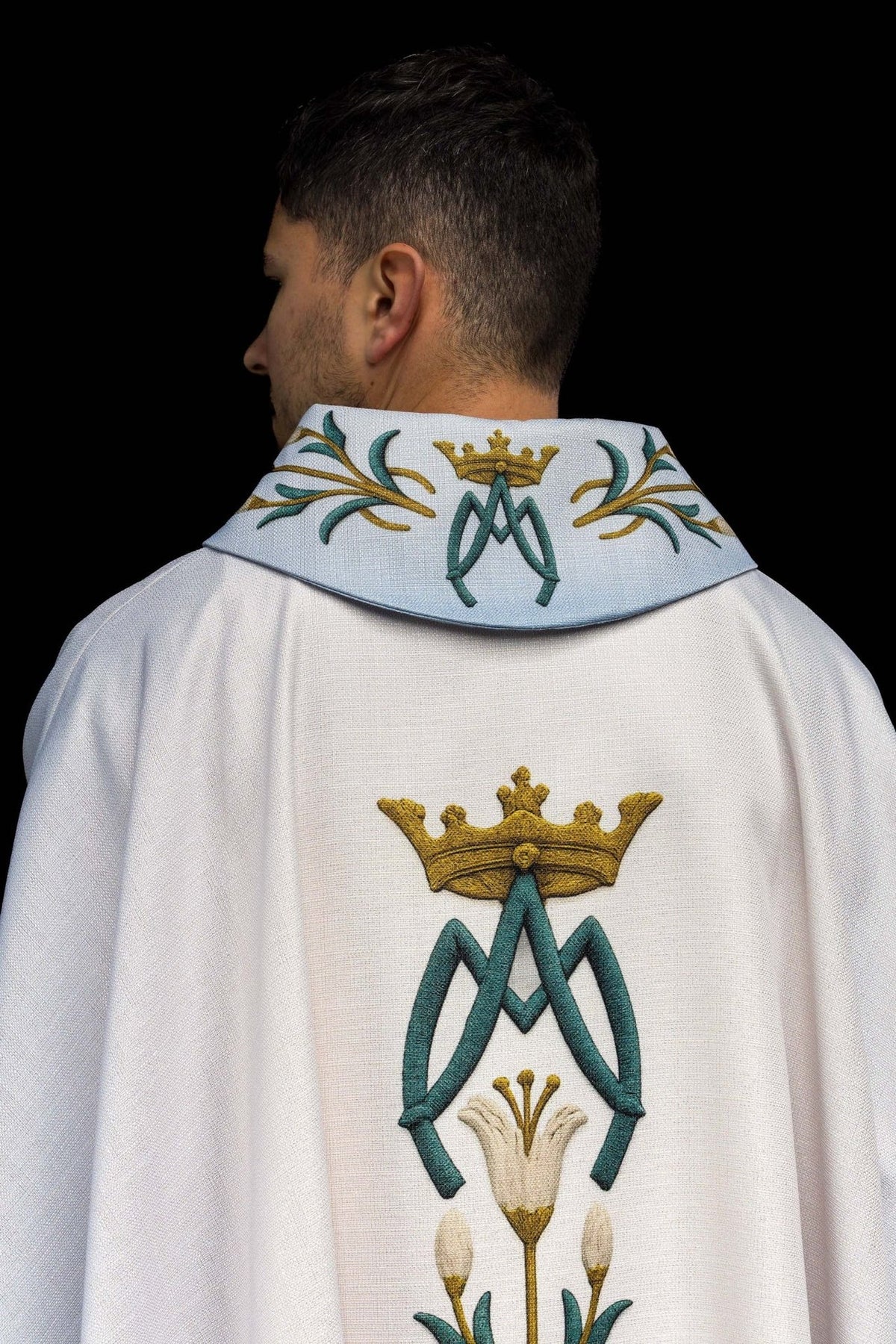 Marian chasuble back view with central lily embroidery and light blue panels