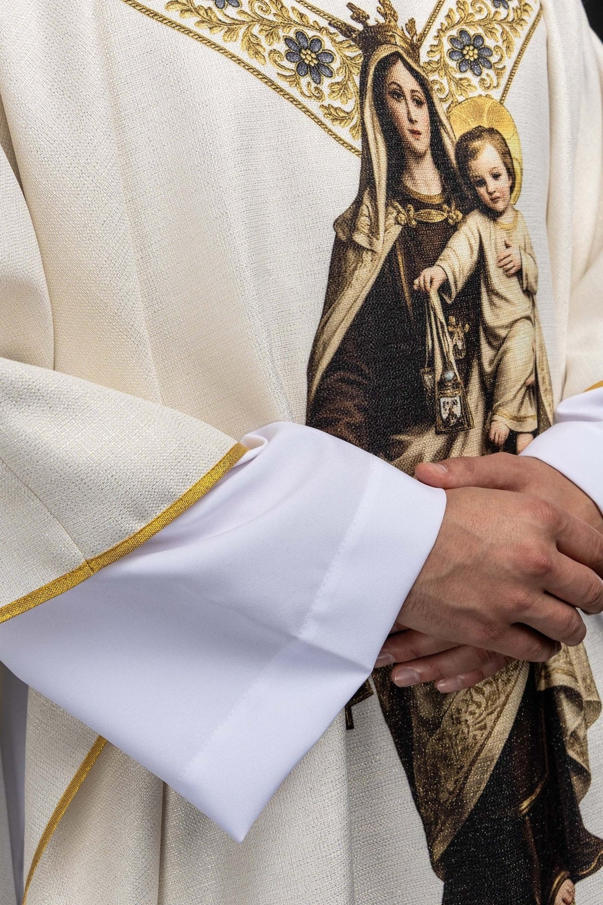 Marian chasuble side close-up showing gold trim, sleeve and Our Lady image