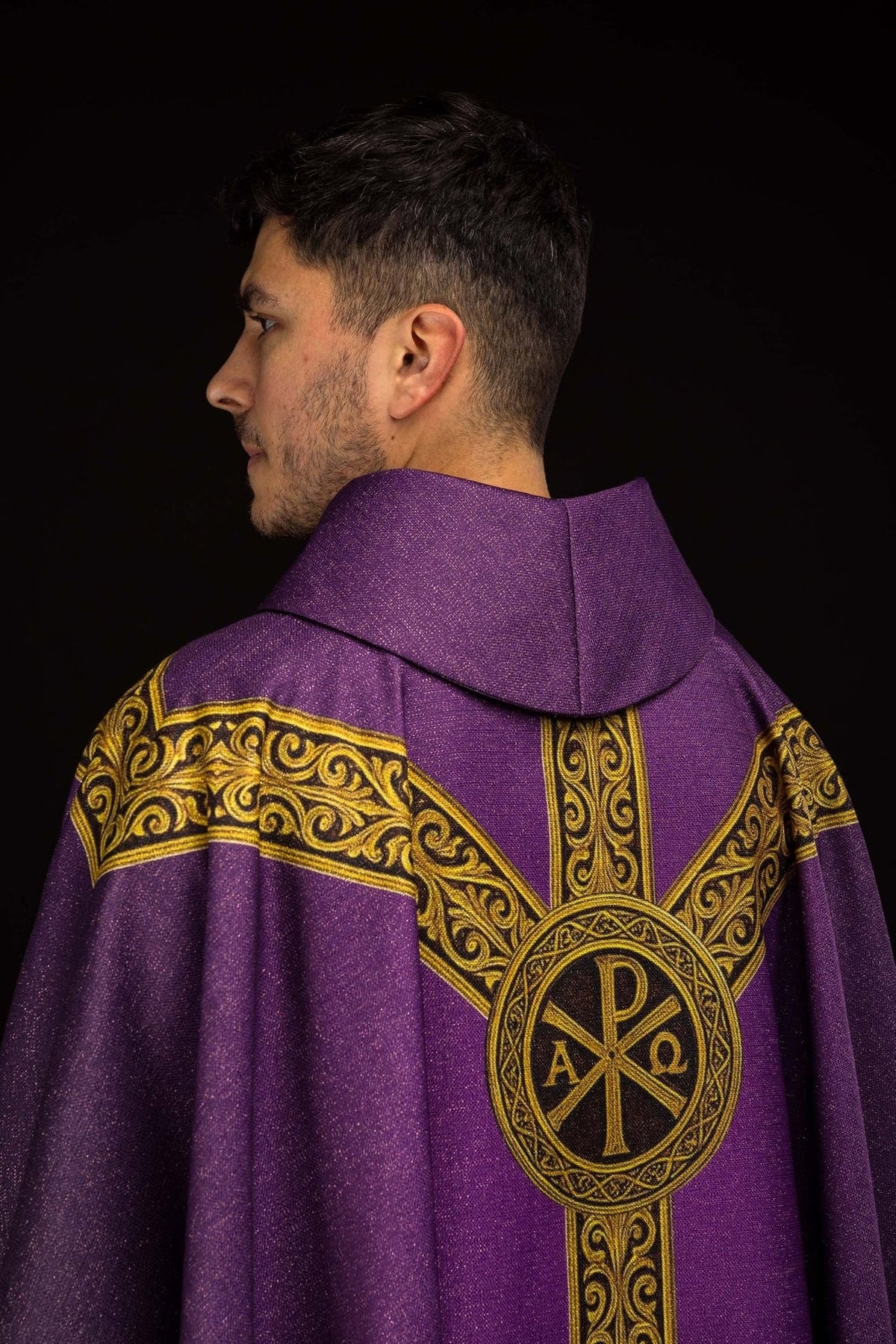 Pax chasuble back close-up with purple collar and gold orphrey