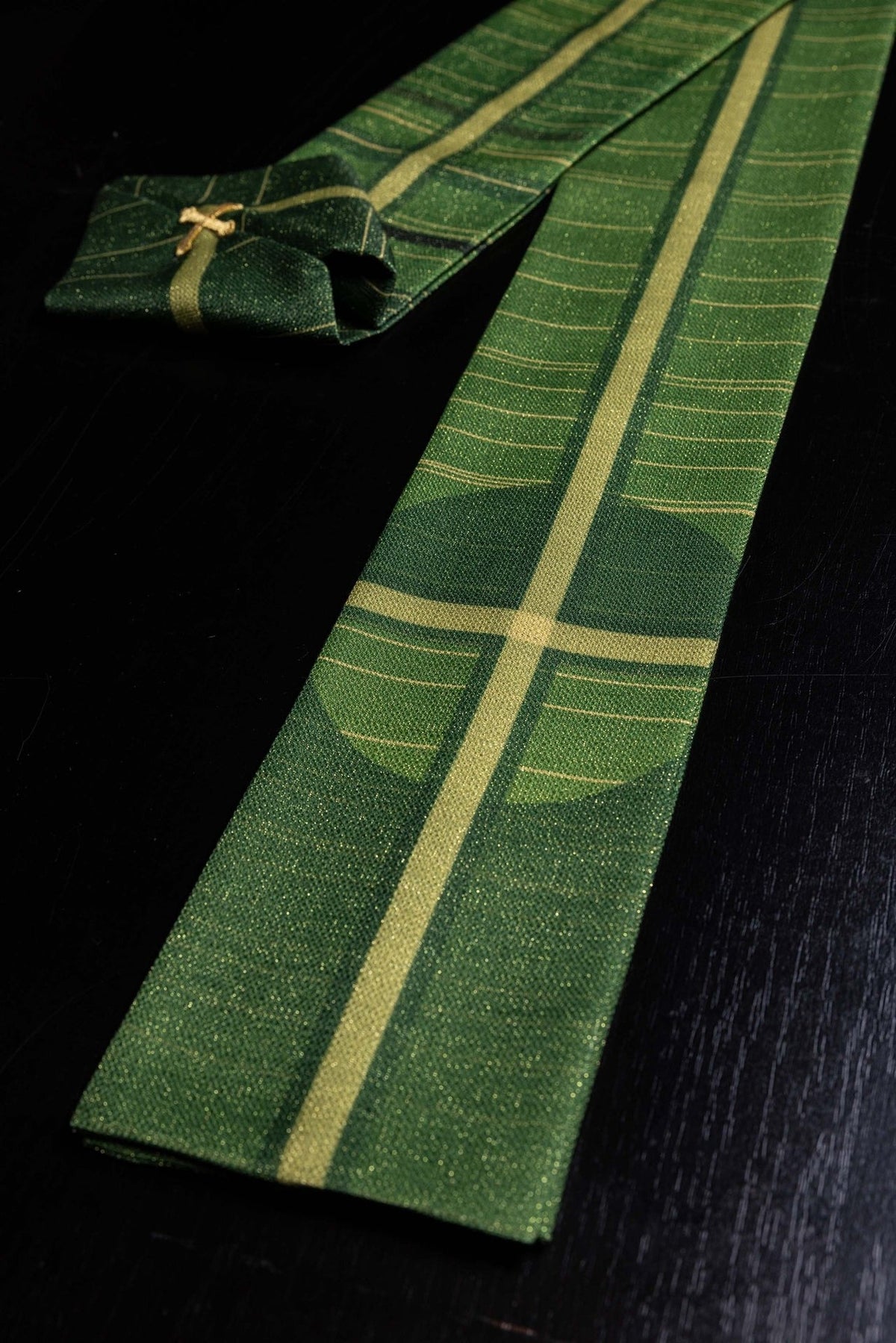 Green Printed Chasuble with Cross Motif, close-up of green fabric with gold cross bands