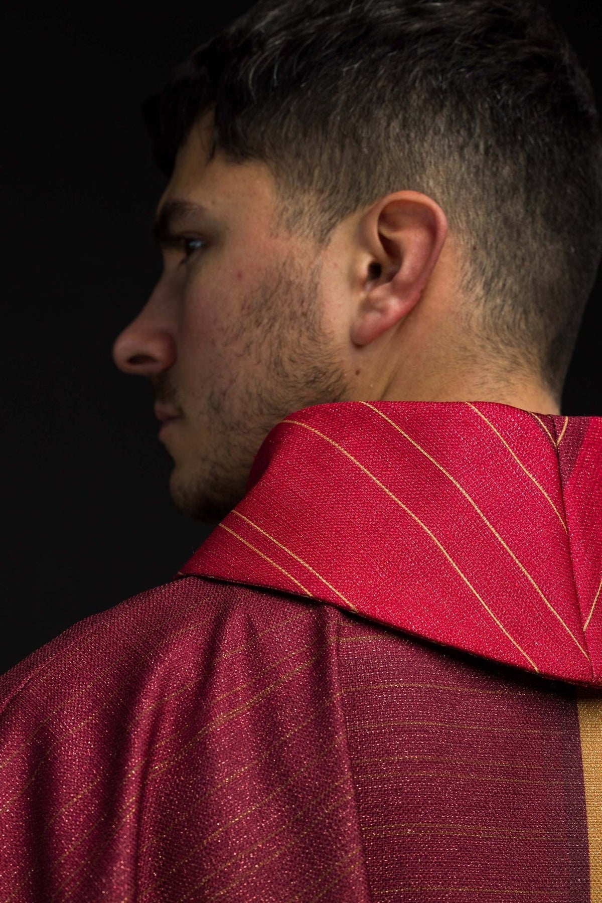 Red chasuble striped collar close-up