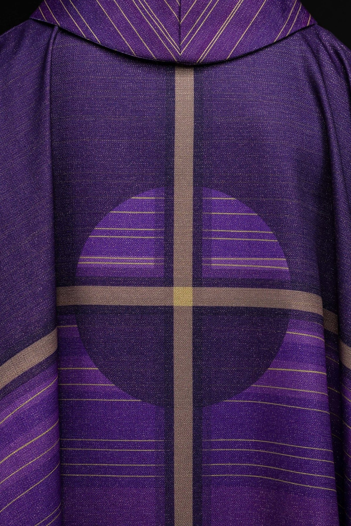 Purple cross chasuble, side close-up showing purple sleeve and striped lower panel