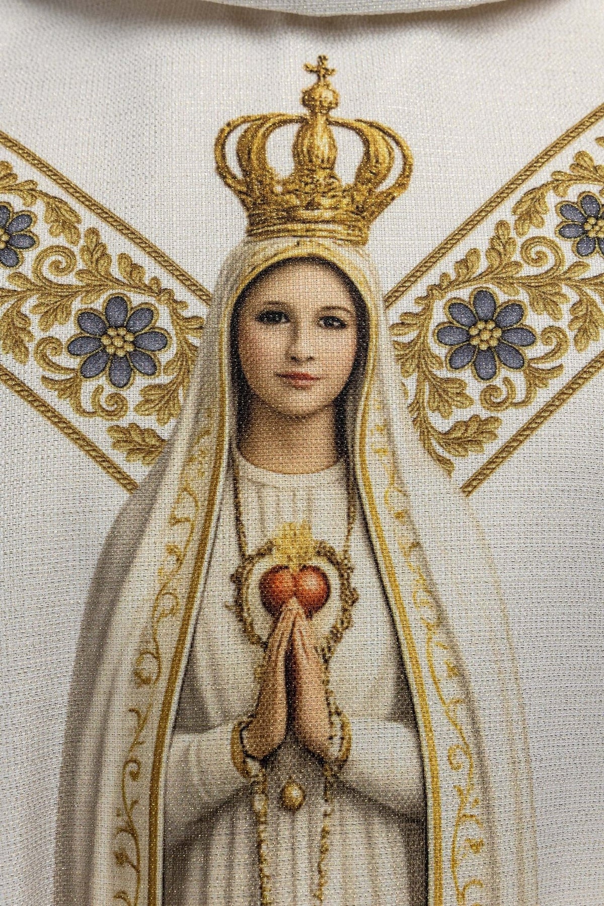 Our Lady of Fatima chasuble close-up showing crowned Marian image and floral trim