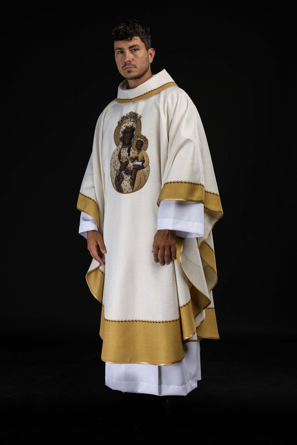 Printed chasuble worn at an angle, showing Our Lady and gold trim