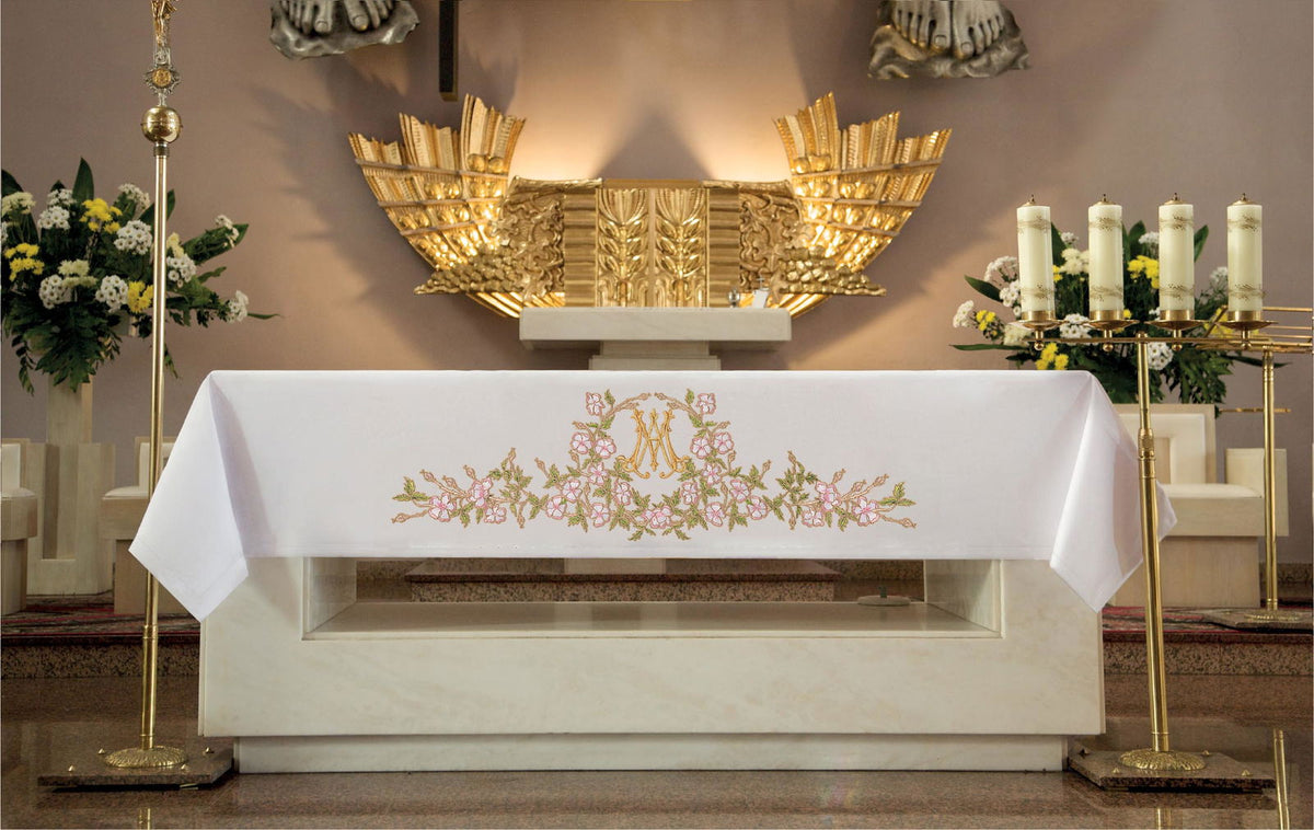 White altar cloth front view with centered Marian motif and floral embroidery