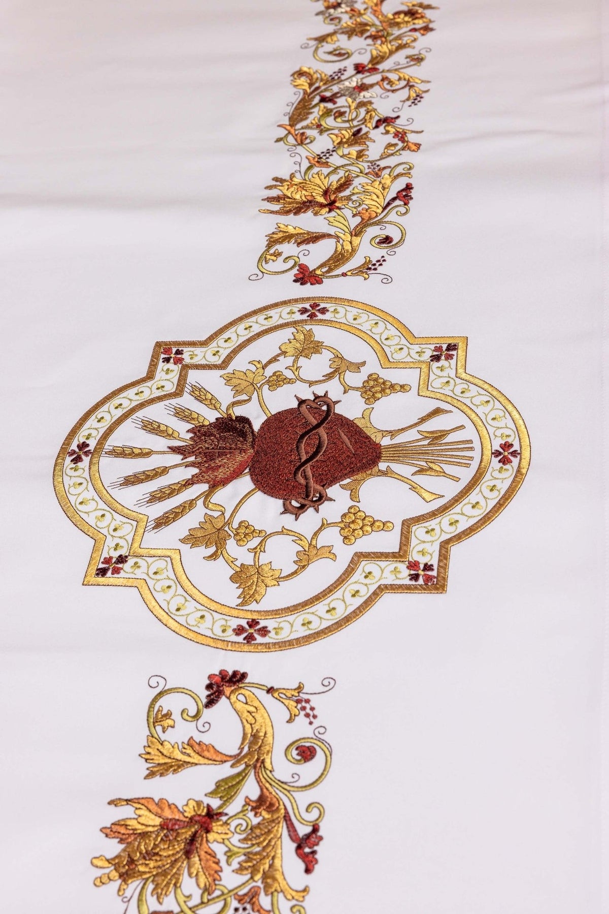 Sacred Heart of Jesus altar cloth close-up showing ornate gold, red and brown embroidery