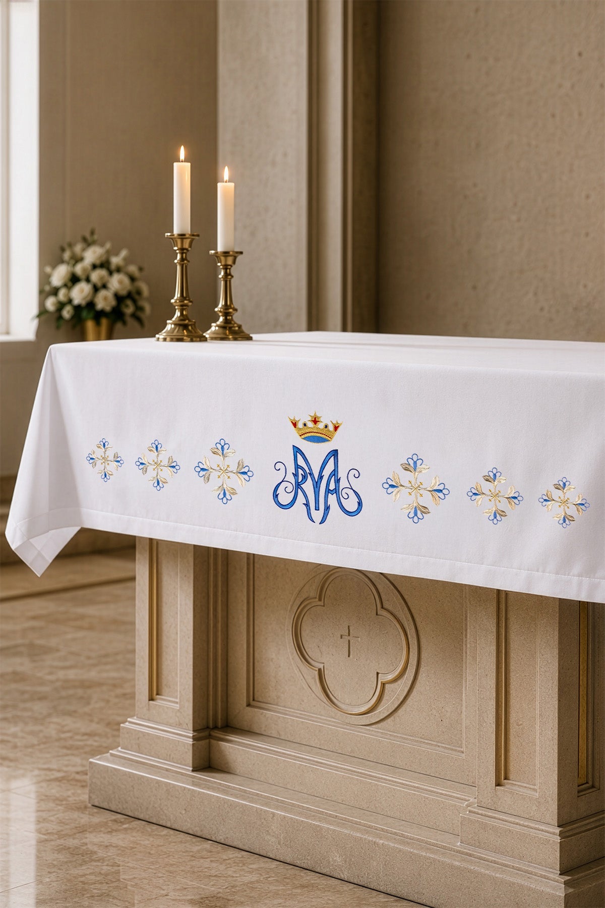 Altar Cloth with Blue Marian Front Embroidery shown draped over an altar, with blue Marian motif and floral embroidery