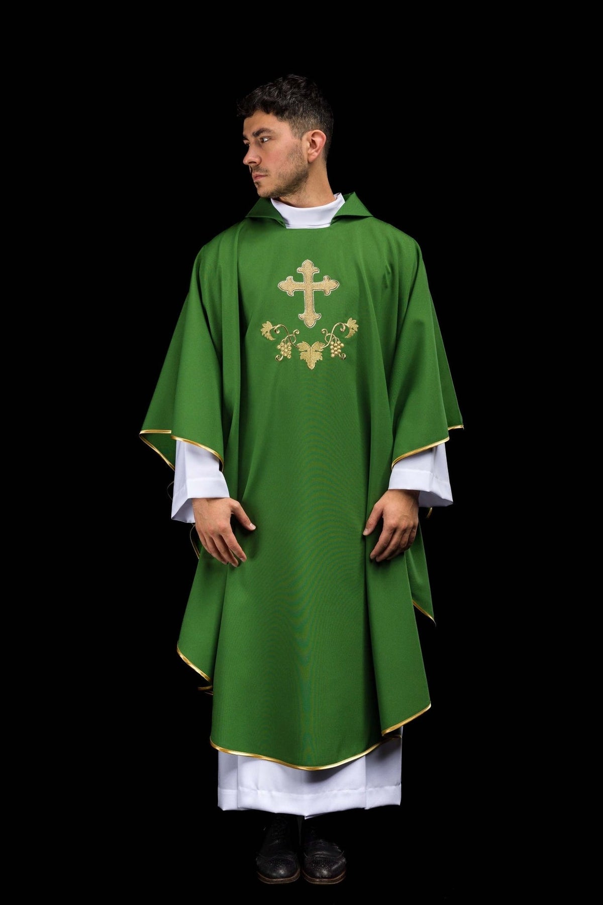 Green embroidered chasuble, full front view with gold cross and trim