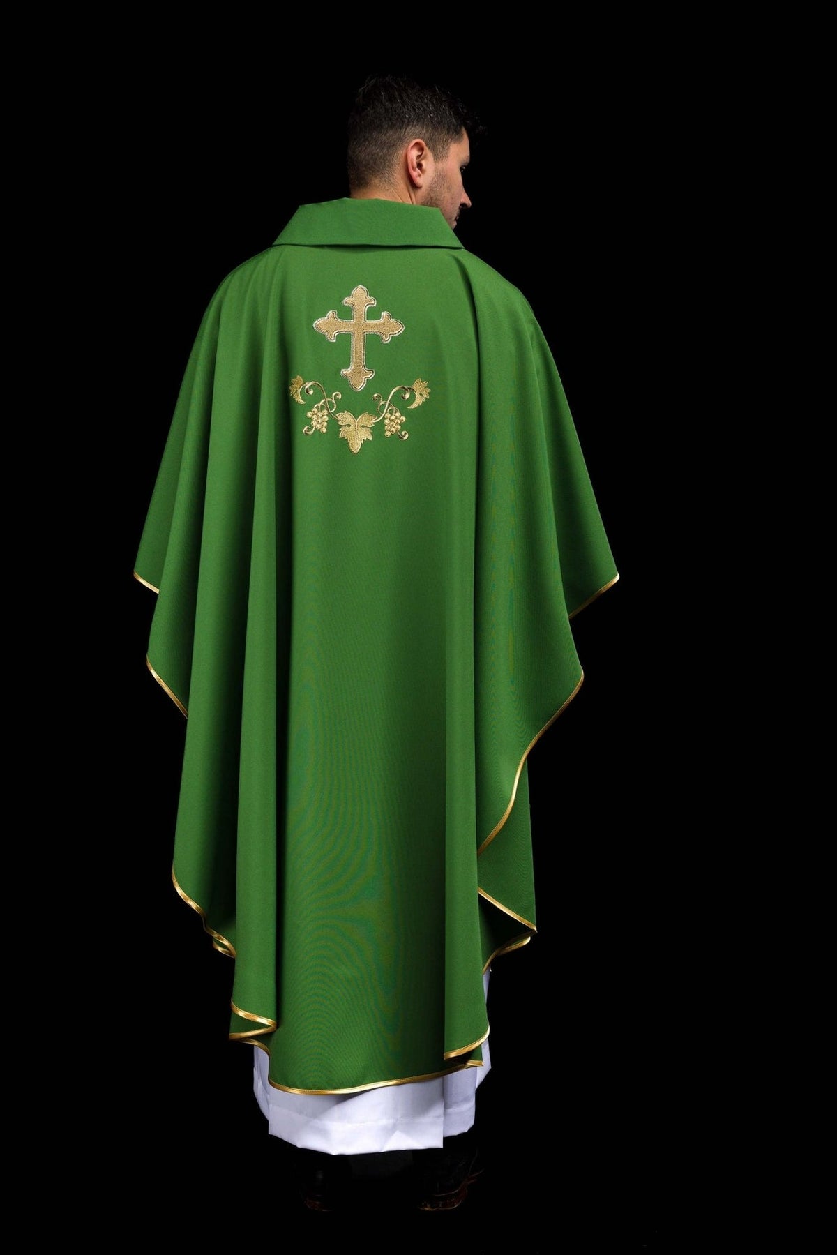 Green embroidered chasuble back view with gold cross and floral embroidery