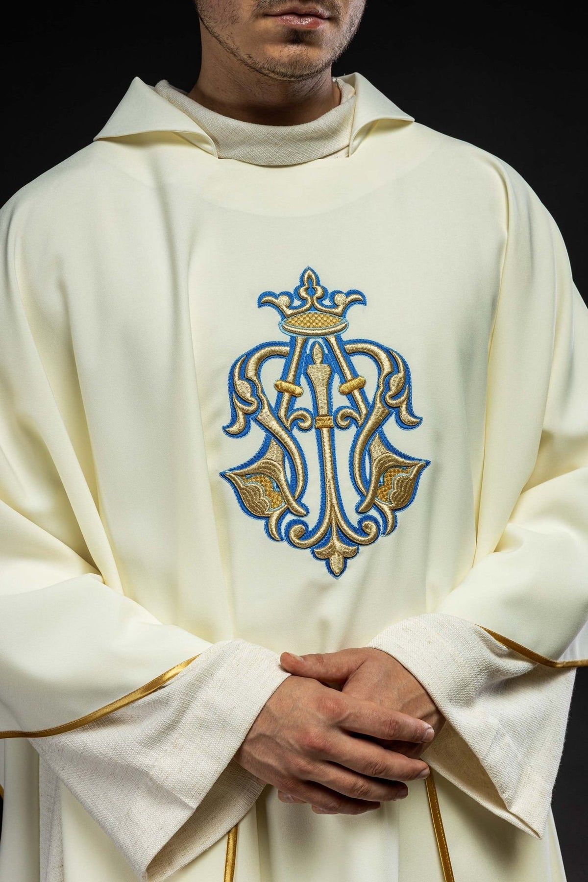 Chasuble front close-up showing Marian embroidery and wide ecru collar