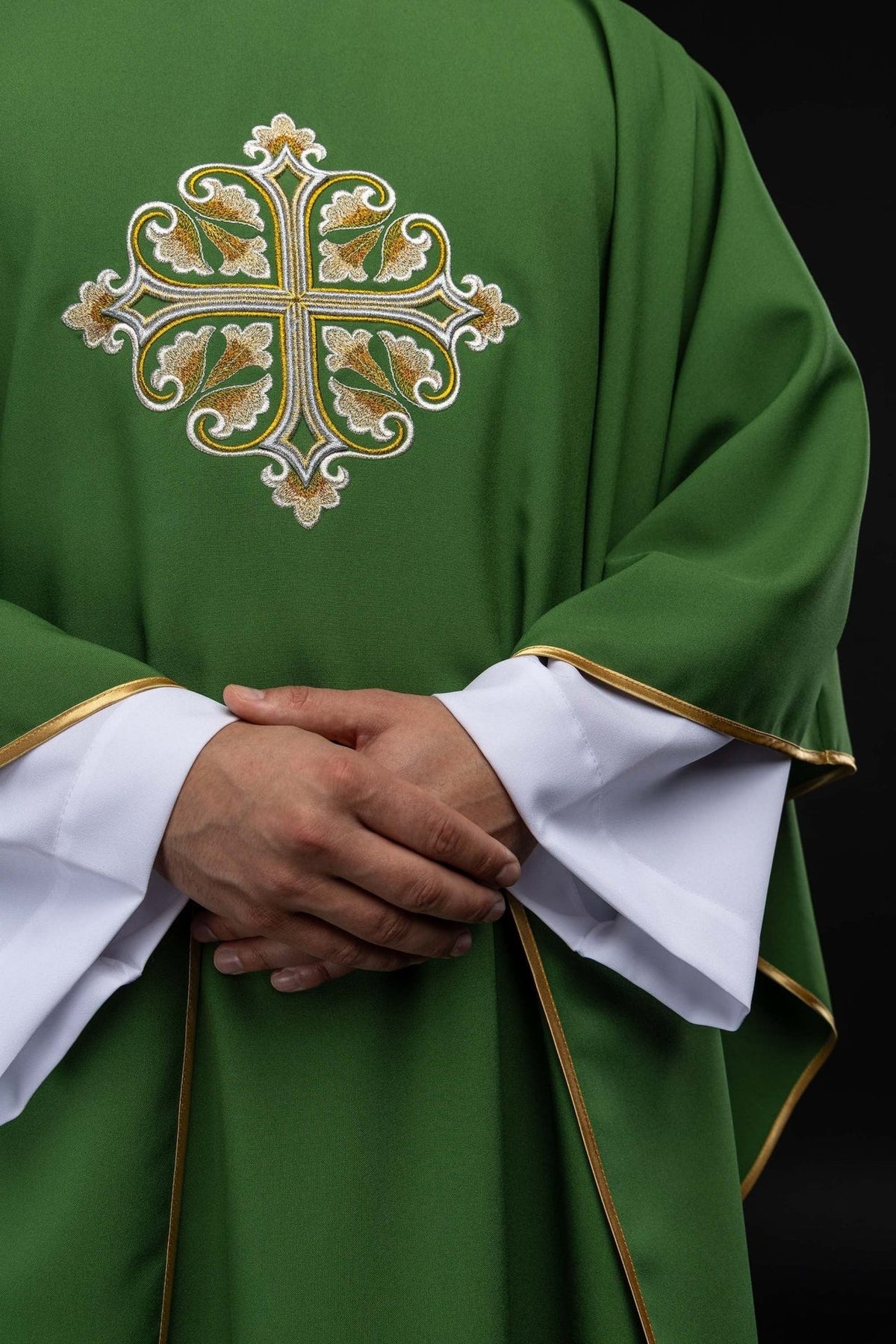 Green chasuble front detail with embroidered cross and gold trim