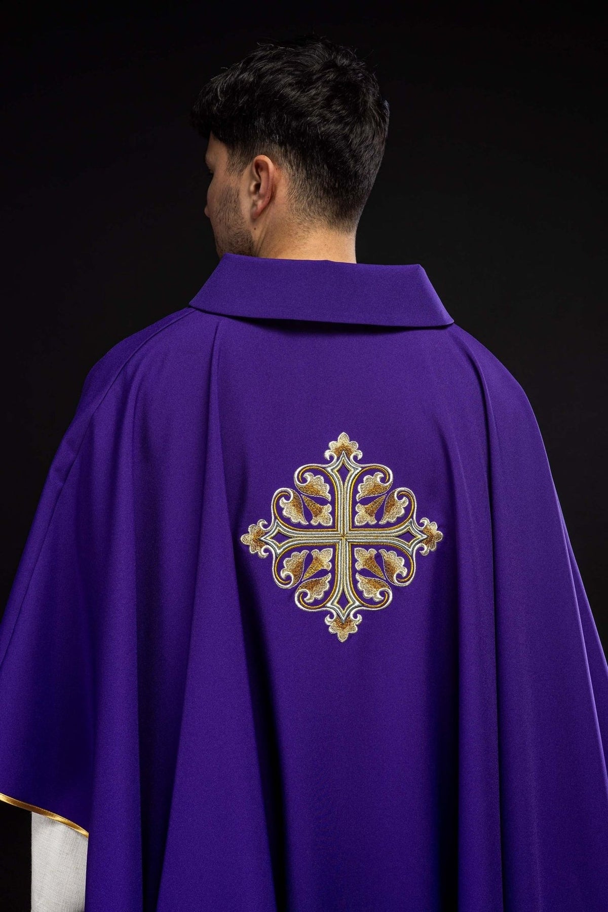 Purple chasuble back view with embroidered gold cross and wide collar