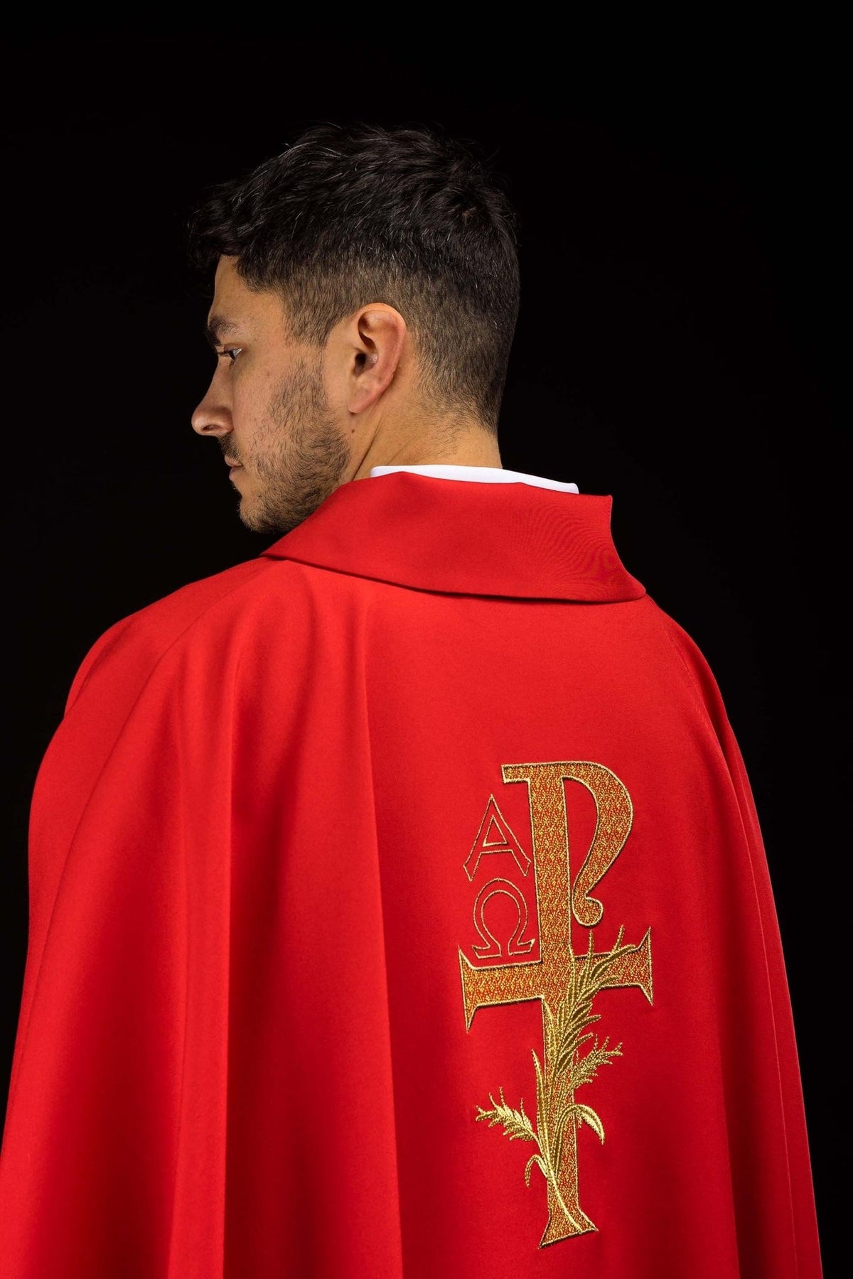 Red chasuble back view with gold Alpha Omega embroidery