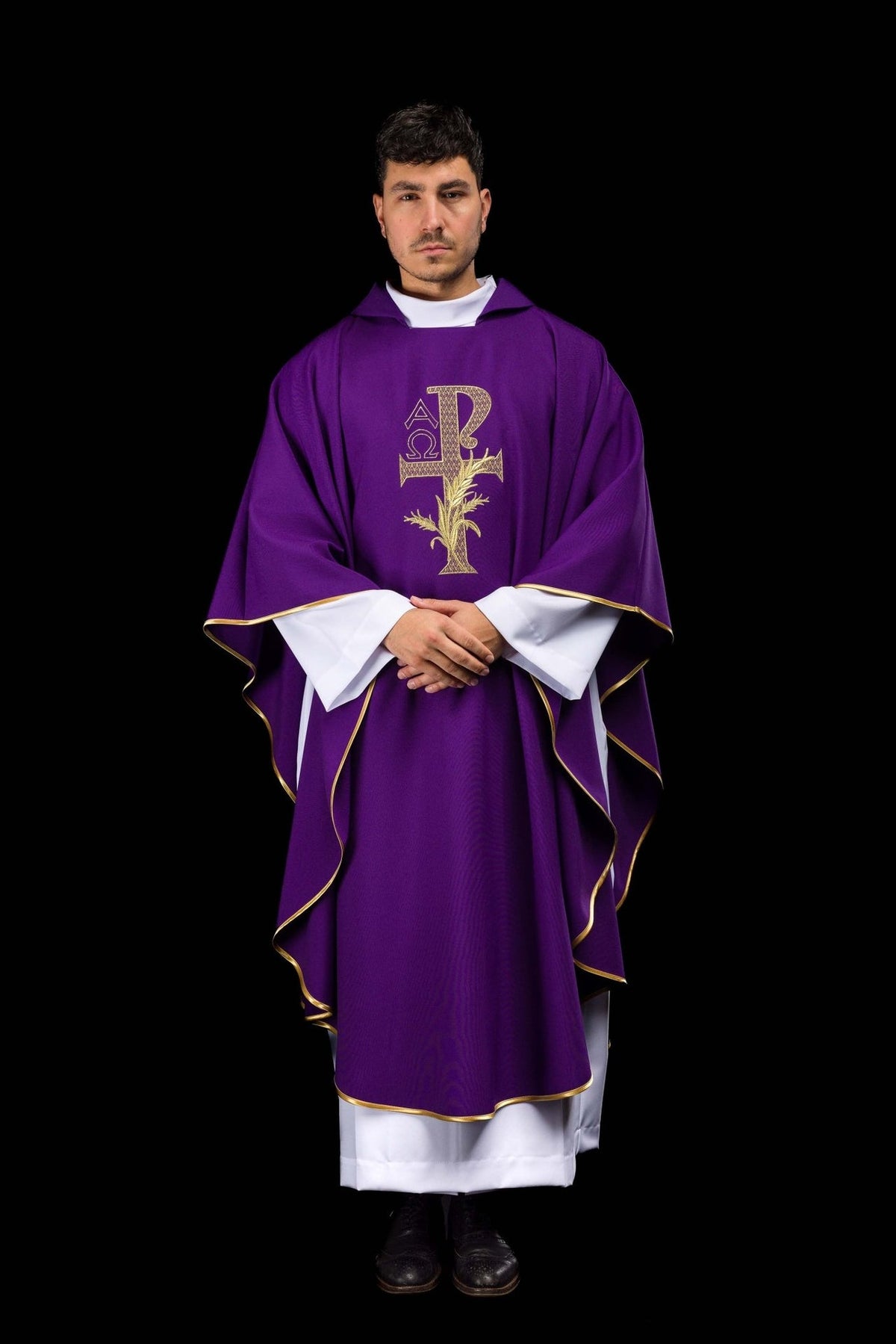 Purple chasuble rear view showing gold Alpha Omega embroidery and flowing trim