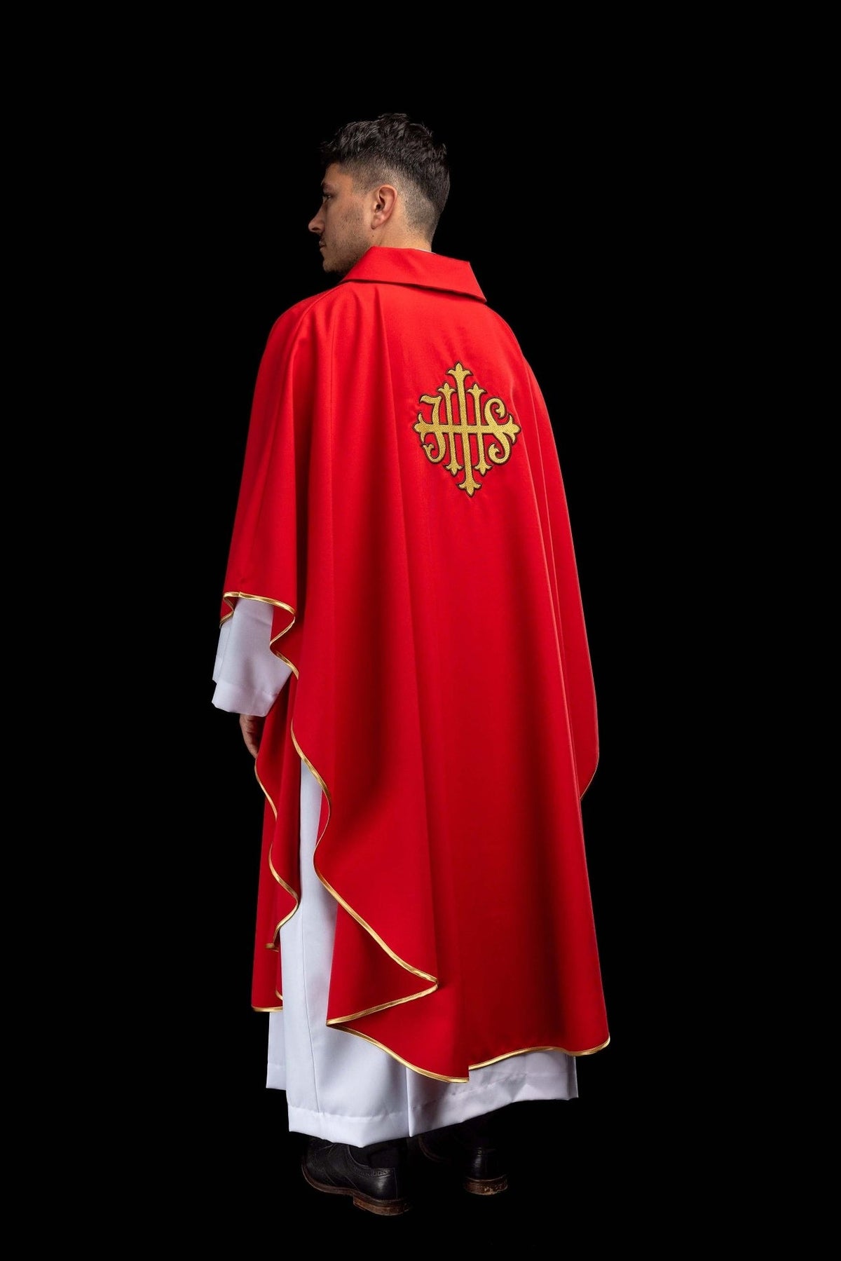 Red chasuble rear three-quarter view with gold trim and JHS embroidery
