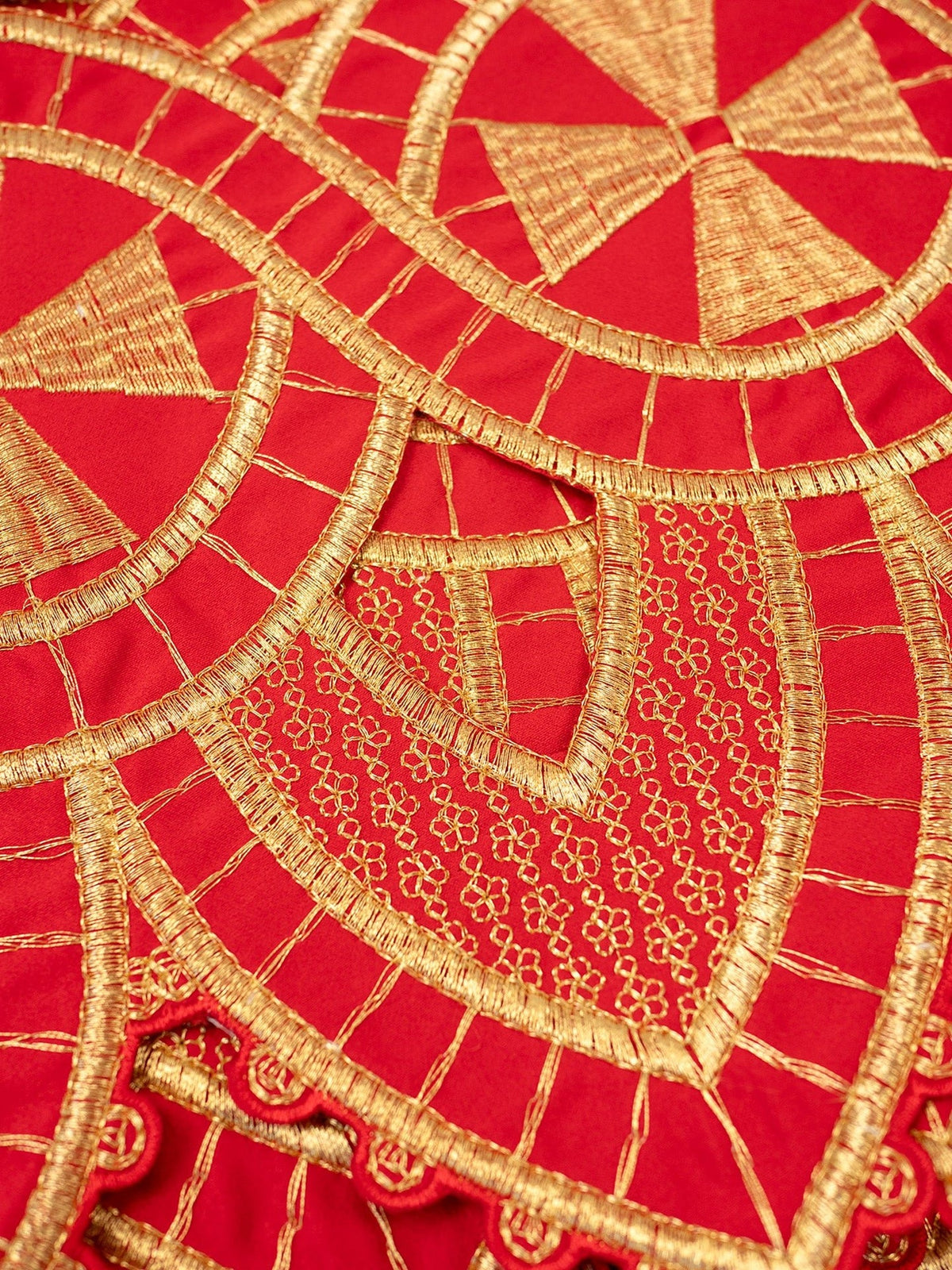 Altar lace close-up showing red fabric and detailed gold embroidery