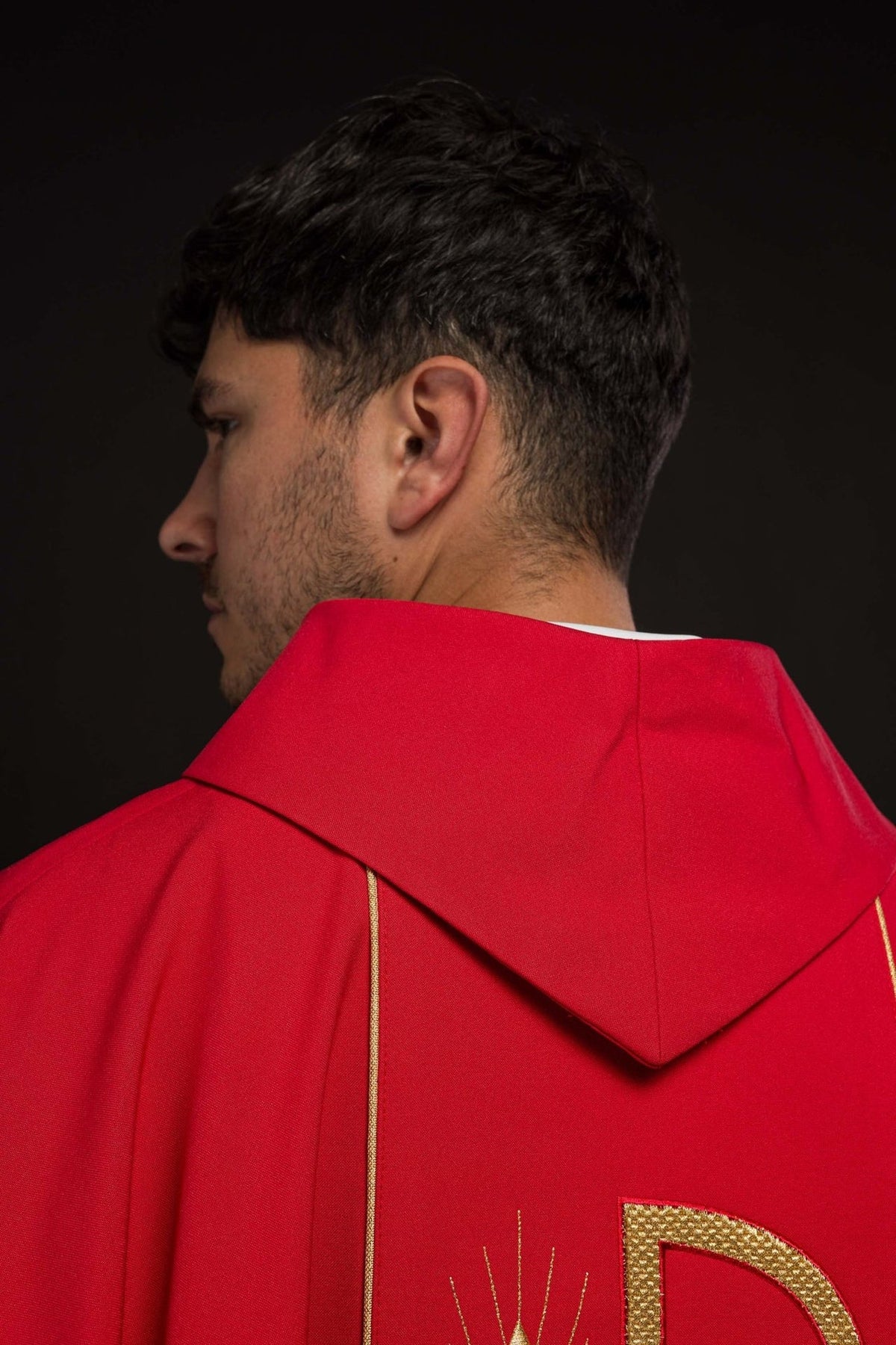 Red chasuble label and red fabric close-up