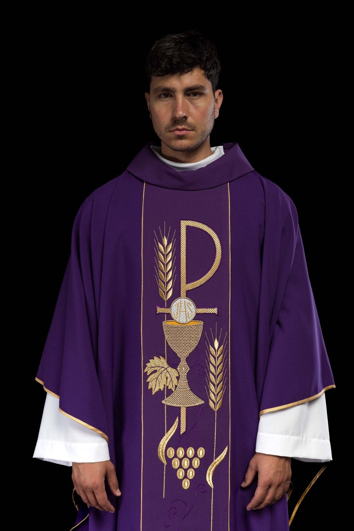 Purple embroidered chasuble front close-up showing IHS chalice, wheat and grape motifs