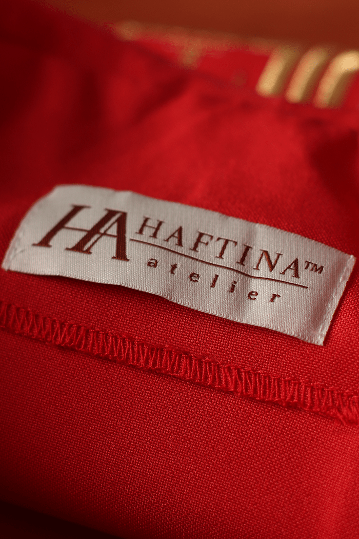 Red chasuble label sewn into the inside fabric