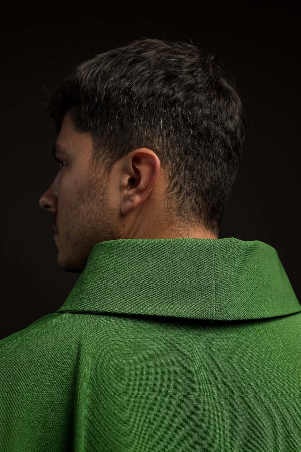 Green chasuble close-up showing the stand-up collar